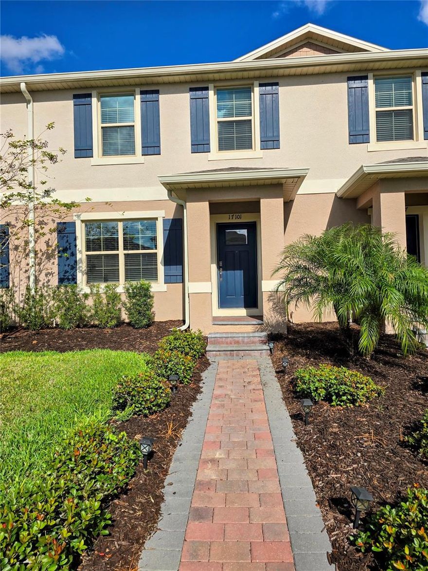 Situated in the sought-after Waterleigh community of Winter Garden, this thoughtfully planned two-story townhome offers a bright and functional living experience. The main level features an open-concept design where the living room, dining area, and kitchen connect seamlessly—perfect for everyday living and entertaining. The kitchen is well-appointed with generous cabinet storage, granite countertops, and convenient access the patio which has been recently upgraded with additional pavers. A half bathroom and a mudroom area complete the first floor.
Upstairs, the home includes a spacious primary suite with a walk-in closet and private bathroom, along with two additional bedrooms and a full shared bathroom. The home’s positioning allows for abundant natural light throughout the day, while the courtyard provides a versatile outdoor space ideal for relaxing or enjoying container gardening.
The Waterleigh community in Winter Garden is served by Orange County Public Schools and offers outstanding convenience for families. Atwater Bay Elementary, Water Spring Middle School, and Horizon High School are located within or just steps from the community, allowing kids to easily walk or bike to school thanks to their close proximity to this home.
Waterleigh is recognized for its well-planned community layout and convenient location. The property is close to grocery stores, restaurants, retail options, and neighborhood parks. With easy access to SR-429, residents enjoy quick connections to Winter Garden Village, Hamlin Town Center, major employment centers, and recreational amenities across West Orange County.