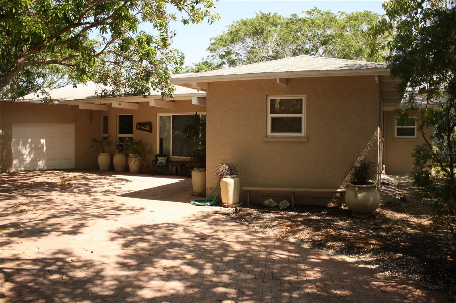 This 3 bedroom 3 bath canal front home is located on the desirable Oak Ave. in the city of Anna Maria with a direct shot to the Gulf beach!
Very spacious and open with a large dining room overlooking the water. There are tile floors throughout, newer windows, and new a/c unit. Boat lovers will love the private boat basin to park your boat. Very private setting with six mango trees!