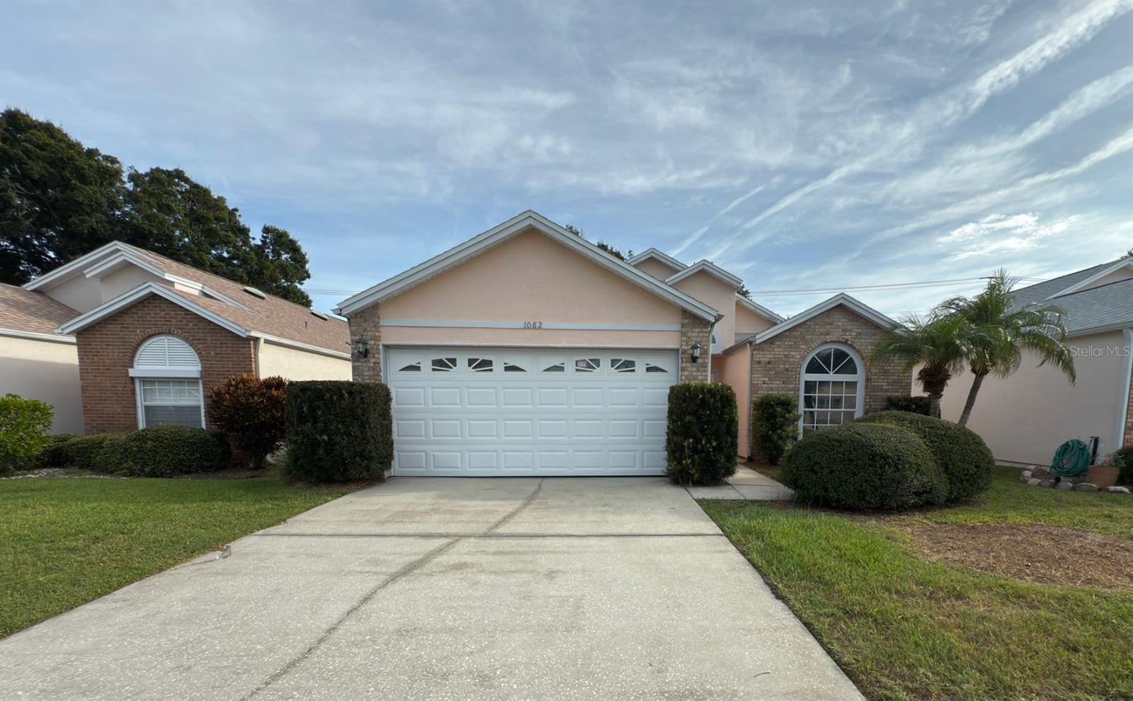 This single story 3 bedroom, 2 bathroom home is located in the peaceful community of South Oaks which includes lawn care, heated pool, spa and even a sauna to relax those aches and pains away. The split floor plan allows privacy for the primary suite and guest bedrooms which share a full bath. There is a lovely screened and covered lanai right off the large family room making entertaining both indoors and outdoors even easier. The kitchen has ample countertop and cabinet space for all your culinary needs and even has a dining space strategically placed under a large skylight. The primary suite has sumptuous carpet, along with a ceiling fan to make sleeping more comfortable and an ensuite bath which includes a step in shower for ease of use. The washer and drier are conveniently located in the garage to minimize noise when using them so you can hear your guests or favorite tv shows. The screened and covered lanai overlooks the back lawn and a treed area while providing a gentle breeze from the ceiling fan. REPLUMBED 2016; ROOF 2012; HVAC AND HOT WATER TANK NEWER ALSO
