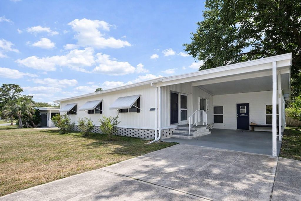 Photo of 7110 Commons Boulevard, Port Richey, FL 34668 (MLS # TB8494663)