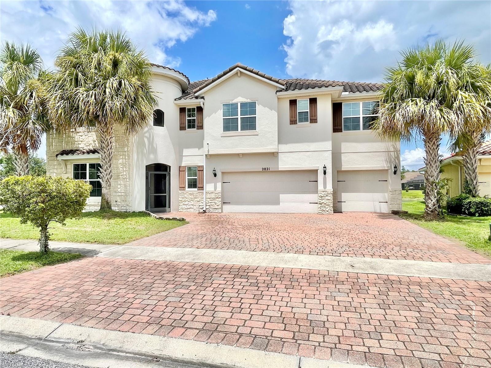 Welcome Home! To your 24hr guard-gated community at Bellalago. This corner lot home is a spacious 5-bedroom, 5-bath featuring two full main suites. One downstairs, and the other upstairs along with the other bedrooms with a large loft adding extra privacy. You will have plenty of storage space throughout, and you can enjoy the pond view from most of the rooms. Having a gourmet kitchen with granite countertops, and a large island, plus a formal dining room, makes cooking and entertaining a breeze! Come to the back, and Imagine yourself In the screened-in back patio overlooking a pond — a perfect spot to wind down and enjoy the view. Take advantage of the community resort-style amenities including a Jr. Olympic pool, water park, fitness center, tennis courts, walking trails, lake access with a boat lift, and an on-site restaurant and bar. Conveniently located near top-rated schools, shopping, and much more! A must see, better yet a must buy! Schedule your showing today!!