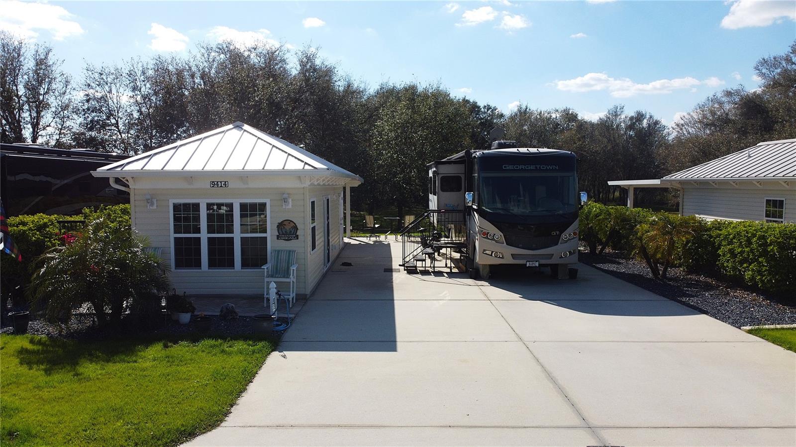 Welcome to Lot 64 in Florida Grande, a stunning 5,000 sq. ft. property offering the perfect blend
of space, privacy, and resort-style living. Designed to accommodate the largest motorhomes, this
back-in, east-facing lot features a 26' x 76' concrete pad with 50-amp electric, water, and sewer,
along with ample space for cars, golf carts, and more. Ten picturesque palm trees surround the
property, creating the quintessential Florida retreat, while full, thick boundary hedges define the
space for added privacy.
What truly sets this property apart is its unparalleled setting—backing up to the resort’s nature
preserve, an area that will never be built on. This ensures breathtaking, uninterrupted views and
stunning sunsets behind the trees, making for the perfect Florida evenings. Enjoy the serene
outdoor living space under the covered pergola, complete with outdoor furniture and a propane
fire pit, both of which convey with the property.
The 384 sq. ft. Grande Suite, a newer build just a few years old, offers a stylish and comfortable
retreat. Inside, luxury vinyl plank flooring runs throughout, complemented by a mini-split
heating and air system for year-round comfort. The fully furnished living area includes a sleeper
sofa, electric theater seats, TV, fireplace, and dining table with chairs. The kitchenette features
sought-after two-tone cabinetry, a beverage refrigerator, and a microwave. The full bath boasts a
walk-in shower, and the laundry/storage room includes a stacked washer and dryer for added
convenience. Outside, pavers extend around the front and back side of the Grande Suite, and a
water softener services both the Suite and the motorhome pedestal.
Beyond this incredible lot, Florida Grande offers top-tier amenities, including a brand-new eight
court pickleball complex, resort-style pool and spa, dog park, and a 20,000 sq. ft. clubhouse with
a fitness center, library, billiards room, craft room, and the impressive Grande Room, where
social events and activities are held throughout the season.
Located in the heart of Central Florida, Florida Grande is just an hour from Tampa, Orlando, and
Ocala, offering the perfect balance of peaceful, unrushed living with easy access to major
attractions. At under $200,000, this is a rare opportunity to own a spacious lot with unbeatable
nature views in a premier motorcoach resort. Don't miss your chance—schedule your showing today!