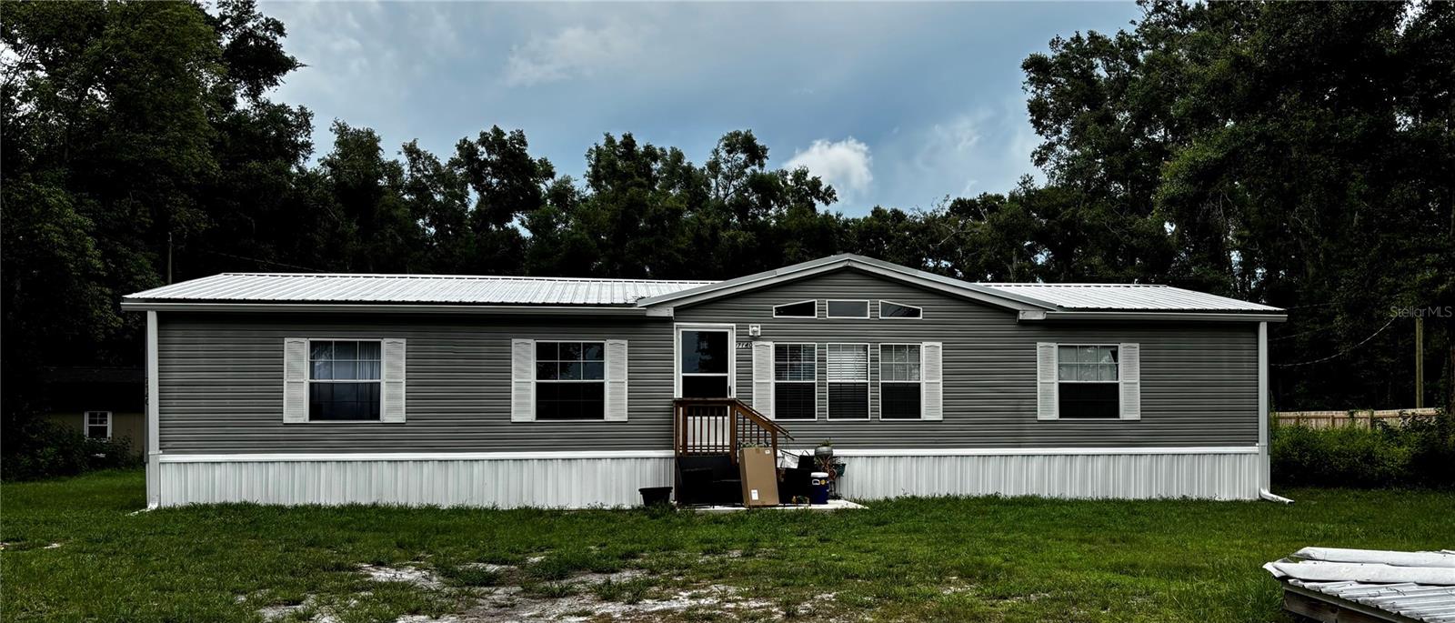 Private showing by appointment may be available by request Monday through Saturday.
ESTATE PROPERTY. POSSIBLE OWNER FINANCING. BEST BUY IN ZEPHYRHILLS, FLORIDA. ALL OFFERS WILL BE PRESENTED TO SELLER. SEE SHOWING INSTRUCTIONS. SOLD AS-IS BUYER/BUYERS AGENT IS RESPONSIBLE FOR VERIFYING HOA FEES & DUES, COMMUNITY RULES, IF ANY, BLDG .SQ FT, HVAC, WATER & POWER SOURCE, LOT SIZE, ROOM/BLDG MEASUREMENTS, FLOOD ZONE, EGRESS/INGRESS, TAXES AND ZONING TO INCLUDE MLS DATA FOR ANY ERRORS AND OMISSION. (Submit all offers on far/bar as-is contract, along with proof of funds or pre-approval.) Rare opportunity for owner/user or investor. Located in Central Florida close to areas such as Tampa, Wesley Chapel and Lakeland. Looking for an Absolutely Spectacular manufactured home that is Move-In Ready! Then this is the Home to SEE! This quality Homes Marrit, Inc. manufactured home features 1,996 Sq. Ft. Living Area on 1.20 Acre lot. Spacious and Open describes this Pristine Home with 3 Bedrooms, 2 Full Baths, Family Room with fireplace and Dining areas and a walk-in closet in Master Bedroom and Generator Hookup. 2 Outside Storage Units. You'll also be impressed by the amount of Storage Space. So easy to fall in LOVE with this Incredible Home. No CDD fee. Your Dream Home awaits - Call Today! This Home Is HUGE!