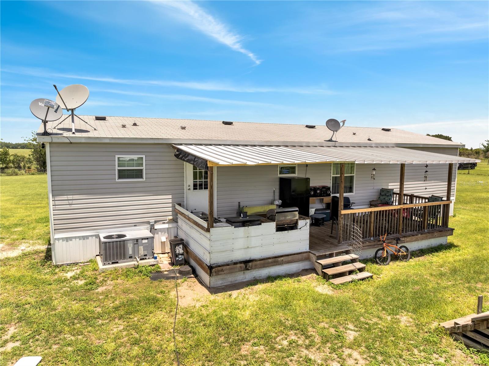 Welcome to Your Peaceful Paradise in Weirsdale, FL
Offered at $329,000 | 3 Bedrooms | 2 Bathrooms | 1,568 Sq Ft | 3 Acres Of LAND
Escape the hustle and embrace the tranquility of country living in this beautifully maintained 2021-built home, nestled on approximately 3 acres of serene Florida landscape. Located in the charming town of Weirsdale and endless outdoor recreation, this property is the perfect blend of modern comfort, rural charm, and endless potential.
As you approach the property, you’re welcomed by open skies, mature trees, and the gentle sounds of nature—setting the stage for a lifestyle that’s both peaceful and purposeful. Whether you're looking to start a hobby farm, enjoy the privacy of wide-open space, or simply relax in a newer home with room to grow, this home checks every box.
Step inside and you'll immediately notice the open-concept design, with natural light pouring into the main living space. The heart of the home is the spacious kitchen, complete with a center island, walk-in pantry, stainless steel appliances, and plenty of counter space—perfect for entertaining or enjoying quiet nights in. The adjoining dining area and living room make it easy to host guests or spend quality time with family.
The primary suite offers a relaxing retreat, featuring a generous layout, en-suite bathroom, and walk-in closet. Two additional bedrooms and a full bath provide ample space for family, guests, or a home office. The home's thoughtful design maximizes comfort and functionality throughout.
Outside, the possibilities are endless. The 3-acre lot is zoned A-1 agricultural, allowing you to raise animals, grow a garden, build a workshop, or even park your recreational vehicles. Enjoy shared access to Saddlebag Lake, a quiet lakefront area perfect for fishing, canoeing, or soaking in Florida’s famous sunsets. With no HOA and flexible land use, this property is a rare find.
Whether you're dreaming of country life, looking to invest in a smartly priced home, or wanting more space for your lifestyle goals—this home offers the perfect opportunity.