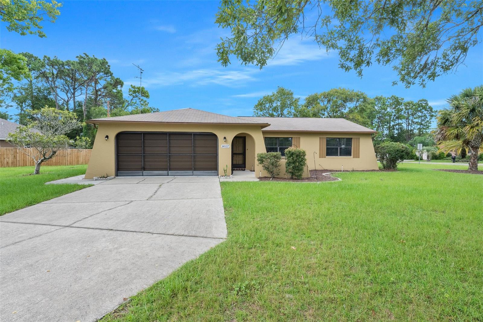 ***BRAND NEW ROOF 2023***This corner lot home is an amazing location and size at .35 acres and a square footage of 1368. This single family home has an open floorpan in the central part of the home, connecting the kitchen to the dining room and family room. The kitchen was updated with formica counters, and still has the original cabinets, bathrooms have been updated, and has new interior and exterior paint on the home. Comes with Dishwasher, Range, Micro hood, and refrigerator. Vinyl plank flooring in the kitchen and the rest of the house has carpeting that looks brand new. The primary Bedroom has a large sized walk in closet, with its own attached bathroom. The connected screened in patio is great for hot summer days to enjoy the weather but not be in the scorching sunlight, you can relax in the comfort of your Lanai with ceiling fan included. This location is just 15 minutes from Publix, and Walmart just a short 4 minute drive to get onto highway 589 which can take you anywhere on the nature coast. Just a 45 min drive from Clearwater and Tampa , with just 25 minutes from the Weeki Wachee springs. Don't miss out on the home that has character, and amazing location. Contact us today!