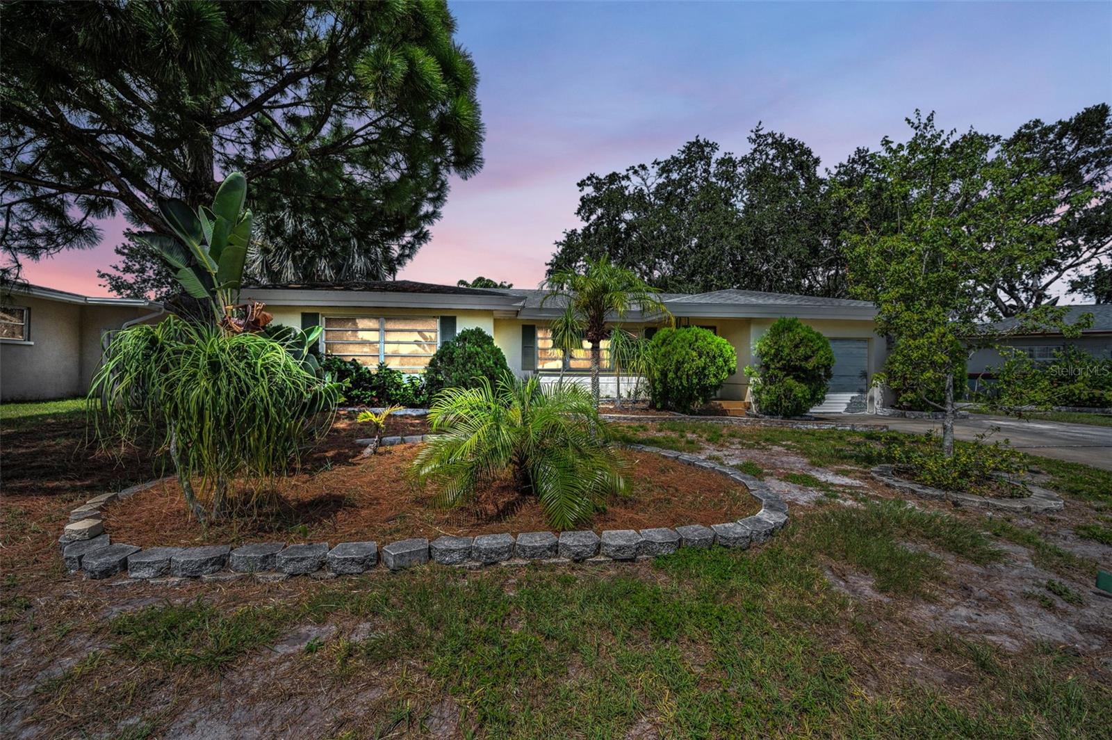 Welcome Home! This spacious and bright 2 bedroom 2 bath home with an oversized 1 car garage and oversized driveway is a perfect place to call home! The home is located on a quiet, circular street. Once you walk inside the first thing you will notice is how spacious all the rooms are. The kitchen is perfect for preparing big dinners with family and friends! There is a separate dining room and bonus/family room with a pass through from the kitchen. Either room could be converted to add an additional bedroom, playroom, or even office space. The pool and patio area are a tropical paradise with a glistening Pebble Tec pool and birdcage screen. Outside the pool area is a paved area with a Pergola to sit and enjoy your morning coffee in peace. This home is located 5 miles from the sugar sand beaches of Clearwater Beach and Sand Key. It is also 2 miles to Eagle Lake Park, one of the nicest parks in Pinellas with a 162 acre preserve with some of the best walking trails, lakes filled with turtles, playgrounds, and picnic areas. Schedule your showing today!