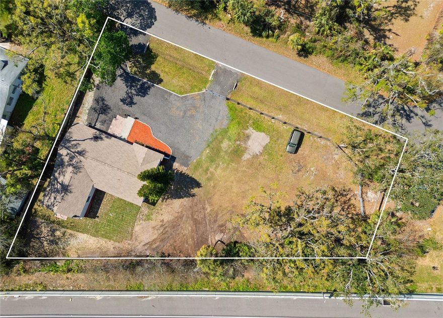 One or more photo(s) has been virtually staged. Spacious Home on Over Half an Acre in the Heart of Bradenton – No HOA or CDD Fees! This charming 3-bedroom, 2 and a half-bathroom home offers the perfect combination of comfort and versatility. An expansive bonus space with a half bath provides endless possibilities for an office, media room, classroom, or multigenerational living. Located on a large lot with room for your boat, RV, and all your hobbies, this property offers ample space for outdoor activities and future expansion. Three separate entrances provide easy access and convenient parking for large vehicles. Inside, you'll find a new hot water heater, newer laminate flooring throughout, bathroom updates, many new fans, lighting and plumbing fixtures, popcorn ceiling removal, fresh interior and exterior paint, and a 2017 roof and new septic system in 2025 making this home move-in ready. The spacious yard is perfect for oversized parking, gardening, BBQs, and more. Enjoy a country feel while being just minutes from I-75, downtown Bradenton, Lakewood Ranch, shopping, dining, hospitals, and the stunning beaches of Anna Maria Island and Bradenton Beach. This is an excellent opportunity for those seeking space, flexibility, and a prime location. Don’t miss out—come see it today and make this home your own!