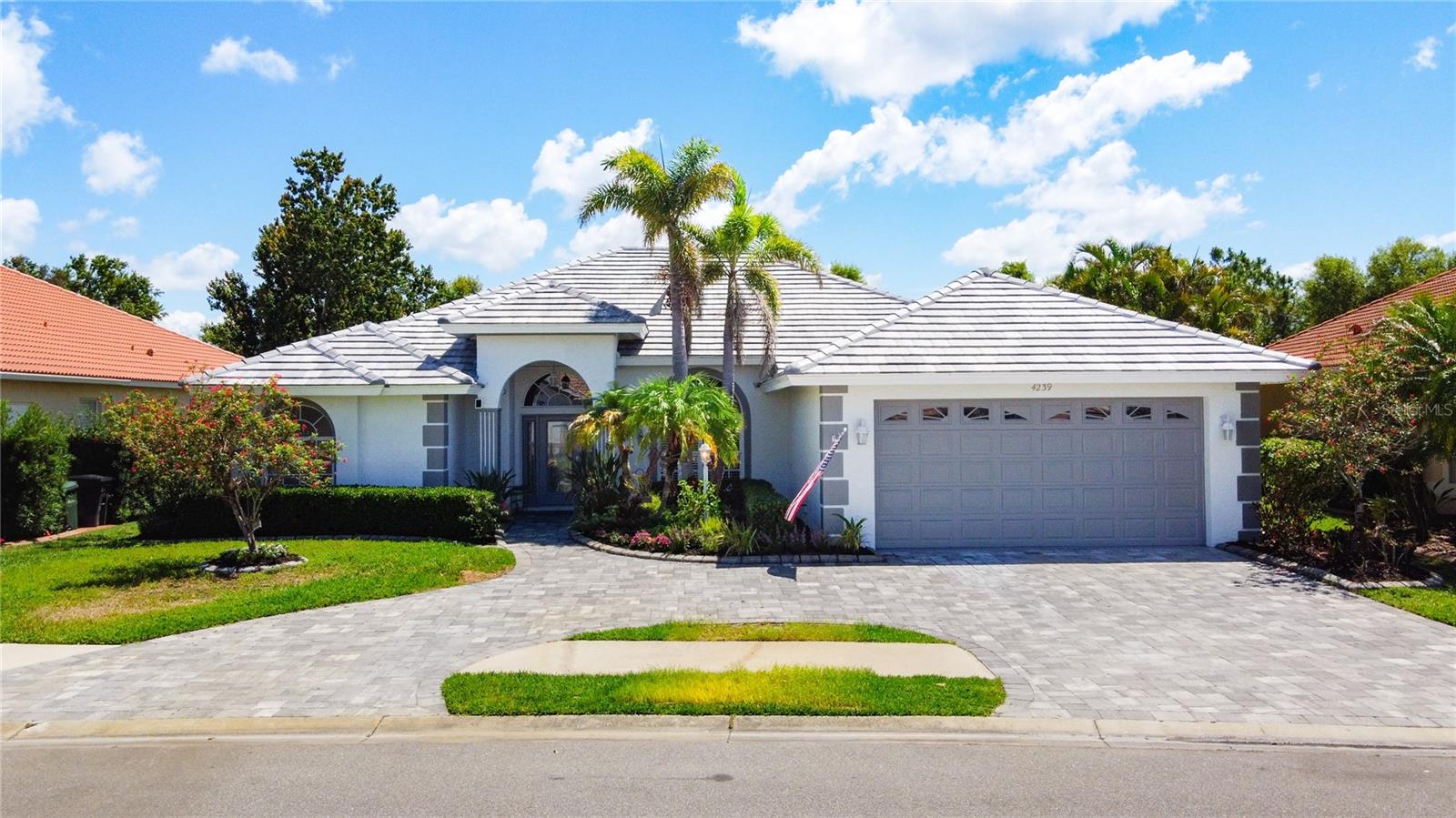 Step into this expansive, beautifully updated home in the friendly, gated Venetia community in Venice, FL. This is one of the largest homes in the neighborhood and a must-see! Renovated in 2016 to include a fourth bedroom, this home also features a spacious den perfect for an office or potential fifth bedroom with a simple closet addition. Imagine cozy evenings by the electric fireplace or hosting friends on the stylish paver lanai, equipped with an outdoor kitchen, granite counters, dual fans, and ample space, all backing onto a peaceful wooded preserve. The louvered lanai roof opens and closes with ease, letting you enjoy the Florida sunshine or shade on your terms. The home sports a new concrete roof (2024), fresh interior and exterior paint (2025), and a modernized kitchen from 2017. With sleek laminate and tile flooring throughout, maintenance is a breeze. The large primary bedroom includes an ensuite bathroom, complemented by three other large bedrooms, two dining areas, a living room, and a family room. The paver driveway, redesigned as a convenient turnaround, adds everyday ease and curb appeal. Beautiful flower beds with landscape rock and concrete curbing enhance the exterior. Seller is offering a 2-year home warranty for added peace of mind. Venetia is an established and coveted community with low HOA fees and no CDD, offering a sparkling pool and spa, fitness center, tennis, pickleball, basketball, bocce, and a lively lineup of social events that make it easy to connect with neighbors. Just a quick trip from the gate, you’re minutes from Venice’s pristine beaches like Manasota Key, Englewood, and Venice Beach, & the Gulf of America. Shopping, dining, golf courses, medical facilities, and the quaint downtown Venice area are all close by, with Sarasota’s vibrant arts, culture, and entertainment just a short drive away. Don't wait, please schedule your showing today!