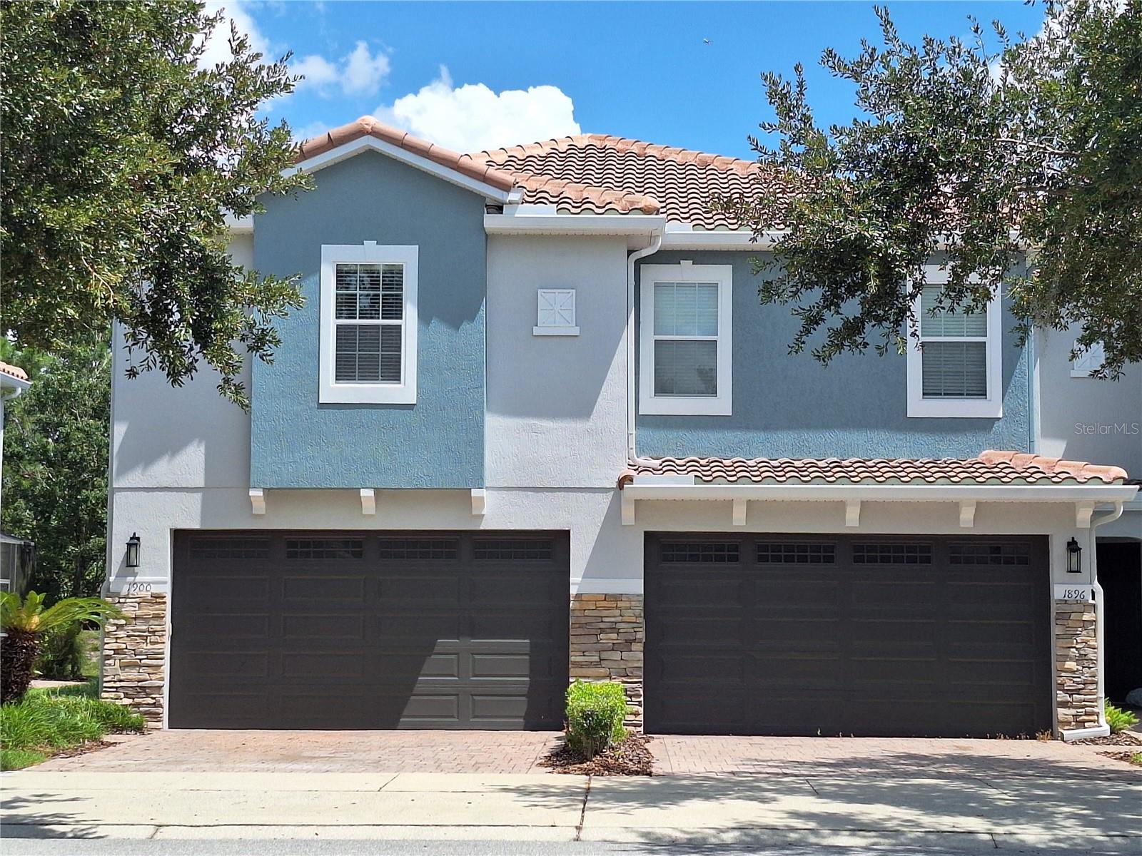 Discover this beautifully maintained 3-bedroom, 2.5-bathroom end-unit townhome offering the perfect blend of comfort, style, and convenience. Located in a secure, gated community known for its pristine upkeep, this home features a spacious open-concept layout ideal for both relaxing and entertaining. The kitchen features granite countertops, brand new upgraded stainless steel appliances, and a convenient breakfast bar ideal for casual dining or entertaining. The unit is tile downstairs and laminate upstairs for a low-maintenance lifestyle. Step onto your back porch and immerse yourself in the serene wooded views. All bedrooms, including a large master suite with a walk-in closet and a master bath featuring double sinks, a tub, and a shower, are located upstairs, ensuring privacy and relaxation. There's also an additional full bath and a well-placed laundry area on the upper floor. There's a powder bath downstairs for your convenience. Being an end unit, you'll share a wall with neighbors only on one side, offering added privacy. Enjoy a bright and airy downstairs with elegant tile flooring throughout.
Subdivision offers amenities such as a pool and playground. New tile roof done in 2024. Rare 2 car garage unit in this very sought after neighborhood that is zoned for good Seminole county schools. This move-in-ready property is ideally situated for an effortless lifestyle. You'll be minutes from SR-417 and major shopping destinations, including the Oviedo Mall, which is directly across the street. This home provides a fantastic opportunity to enjoy a maintenance-free lifestyle in a thriving Oviedo community.