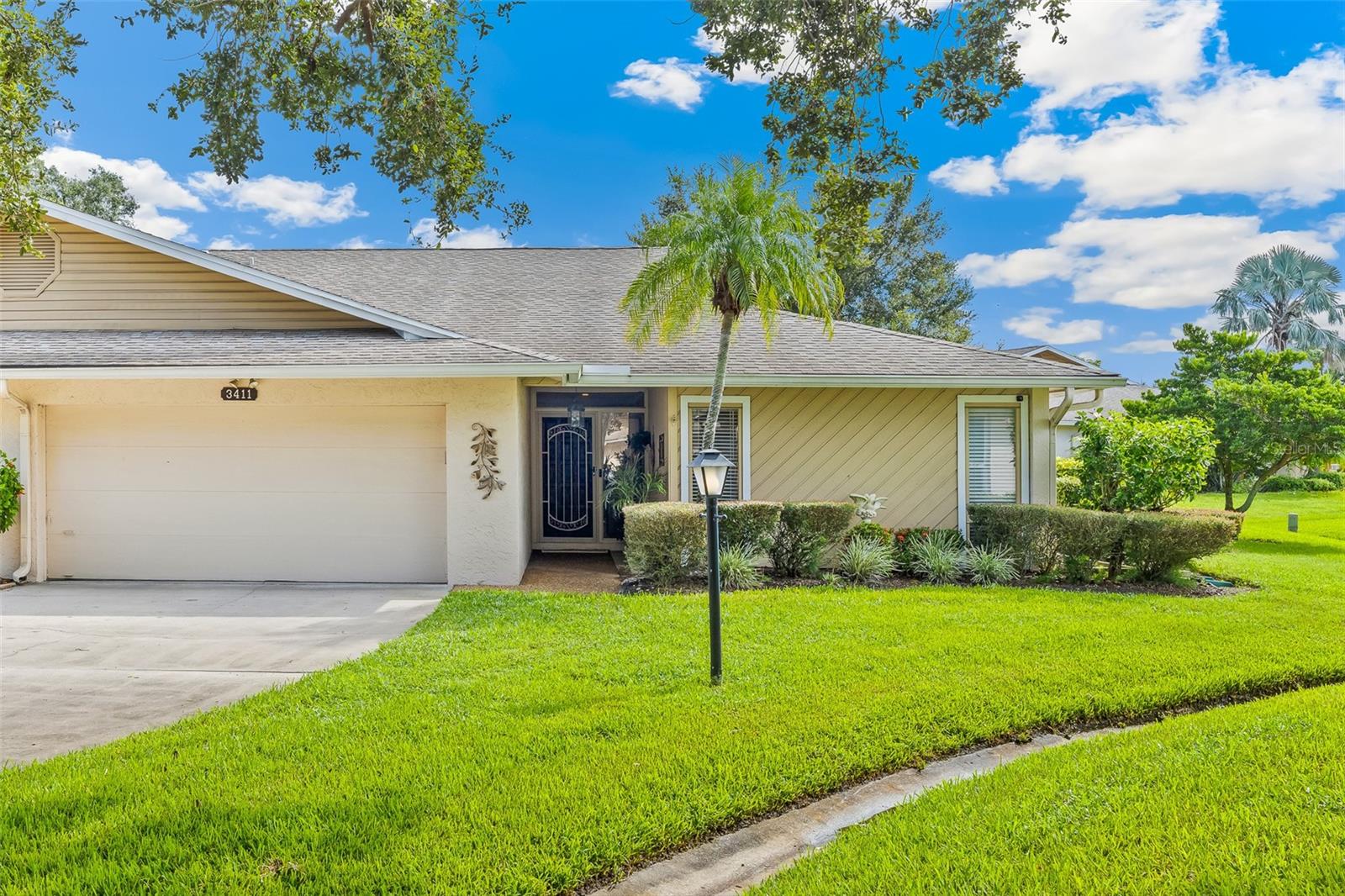 Welcome to this charming 3-bedroom, 2-bath villa offering a spacious 1,812 square feet of living space. Featuring an updated kitchen, with quartz counter tops, new appliances and plenty of light. A wonderful open floor plan, elegant and easy to keep deluxe-vinyl flooring throughout, crown molding in the living areas. Plantation shutters along the back sliders, with built in bookcases in the Sunroom, this home combines modern comfort with style. The property also includes an interior laundry room and a 2-car garage with a wall of cabinets for extra storage. The HVAC is only six months old, the hot water heater is from Oct. 2024. There is a security system in place along with outdoor cameras for peace of mind. Condo Association takes care of the roof. There is a community heated pool, clubhouse and tennis courts. Ideally located, you're just minutes away from shopping, the beach, downtown Sarasota, and all it has to offer. This is not a 55+ community, you are allowed to have one small pet, no leasing allowed. Don’t miss out on this perfect blend of elegance, convenience, and functionality!