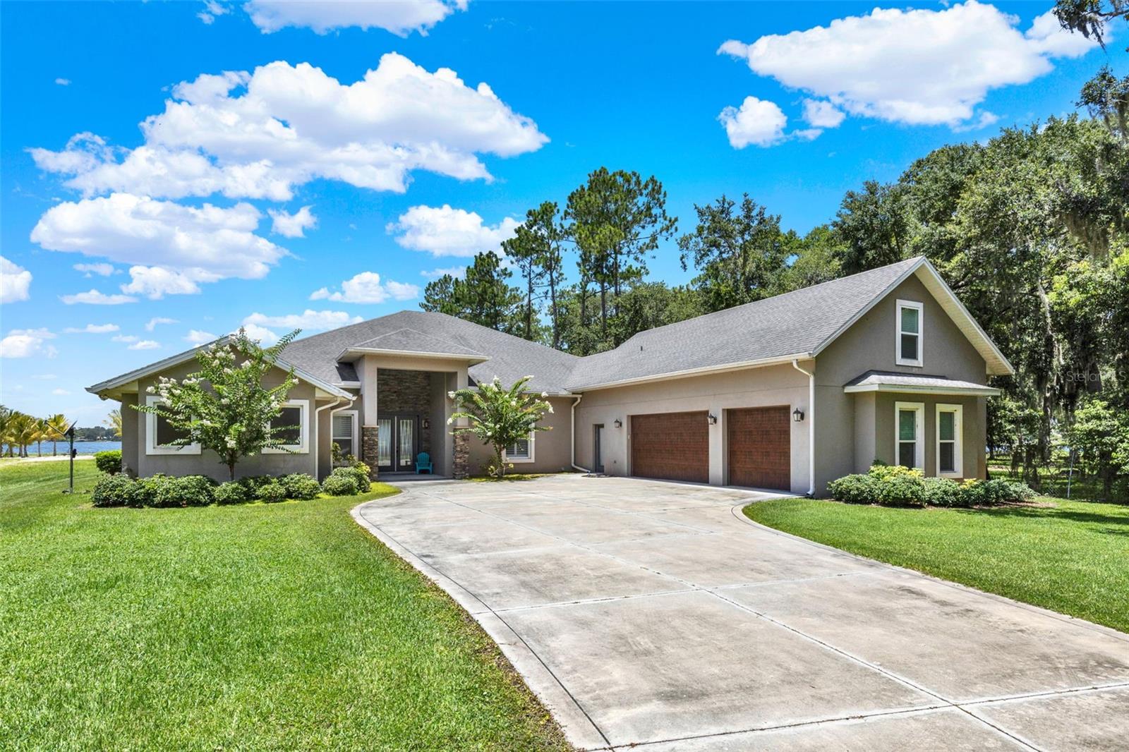 This Central Florida waterfront estate simply has it all to offer. Whether you love magical sunsets or water activities, this is the perfect home for you. Perfectly situated on a sprawling 3.5 acres on the sought after spring-fed, white sand bottom Lake Joanna, this home boasts 5,032 square feet and features 5 bedrooms with 5 full and 2 half baths. This home offers an open floor plan and an abundance of natural light all throughout. A wall of glass sliders help to provide a true indoor/outdoor living feel, seamlessly transitioning out to 2900 square feet of lanai space that features an outdoor kitchen, wood burning fireplace, heated saltwater pool, and 180 degree breathtaking lake views! Additional features include: 3+ acres of privacy, oversized ADA compliant doorways, double ovens, wet bar with wine fridge and ice machine, dock with boat lift, double jetski floating dock, 3 car garage, 26x24 storage shed with 2 roll up doors, security system, secure gated entry, and 1 mile distance from retail centers and 3 miles to the 429. Don’t miss out on the opportunity to own a piece of lakefront paradise. Call to schedule your private showing today!