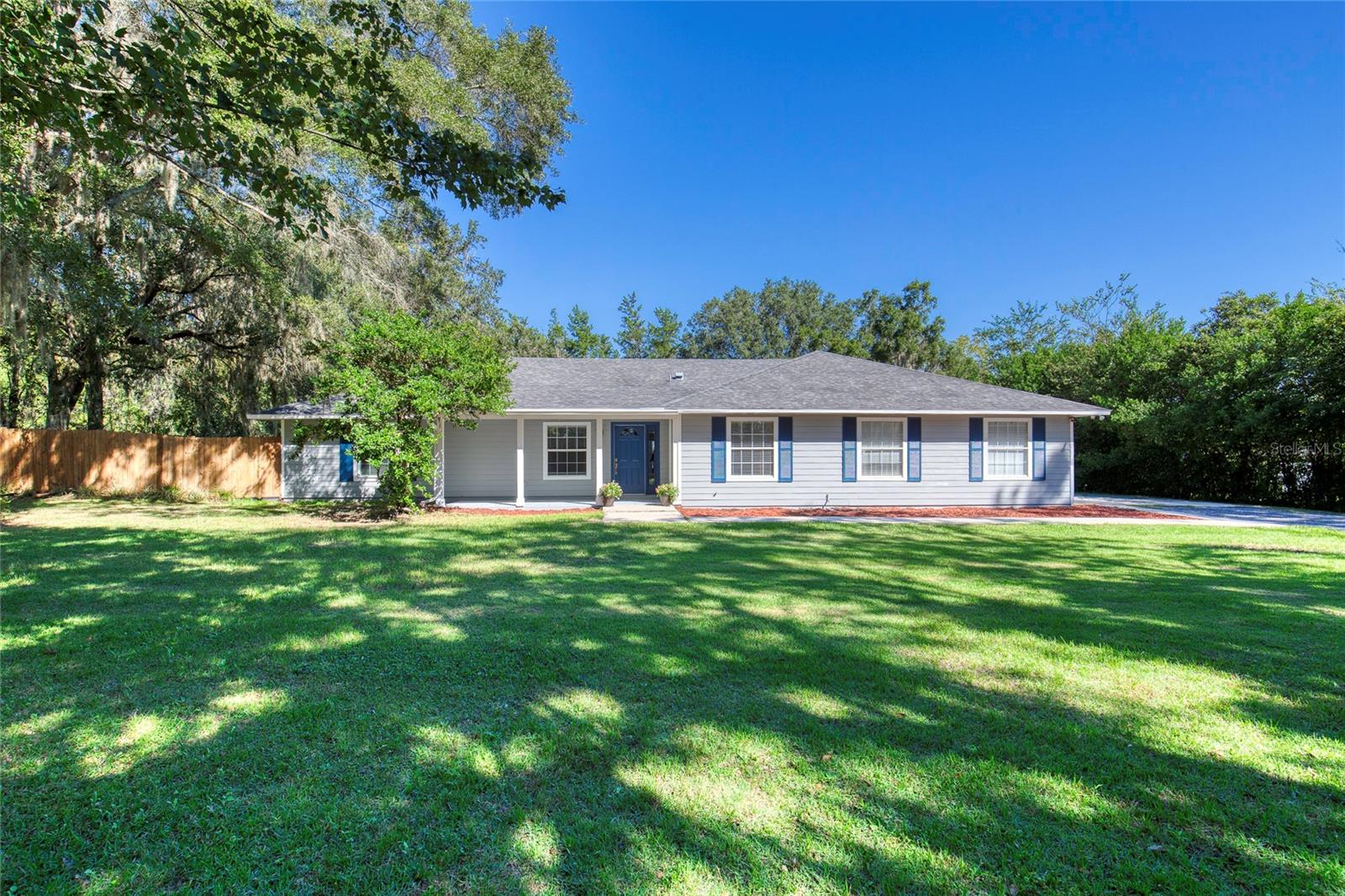 Welcome to your own slice of Gainesville comfort! This 3BR/2.5BA home sits on a full acre and offers 2,579 sq. ft. of living space. The bright, open layout features a spacious living area, stainless steel kitchen appliances, and a flexible dining room that can easily serve as an office or bonus room. Enjoy the Florida room overlooking the peaceful backyard - perfect for relaxing or entertaining. With no HOA, there's plenty of room for your boat, RV, or weekend projects. Country feel, city convenience - just minutes to schools, parks, and shopping.