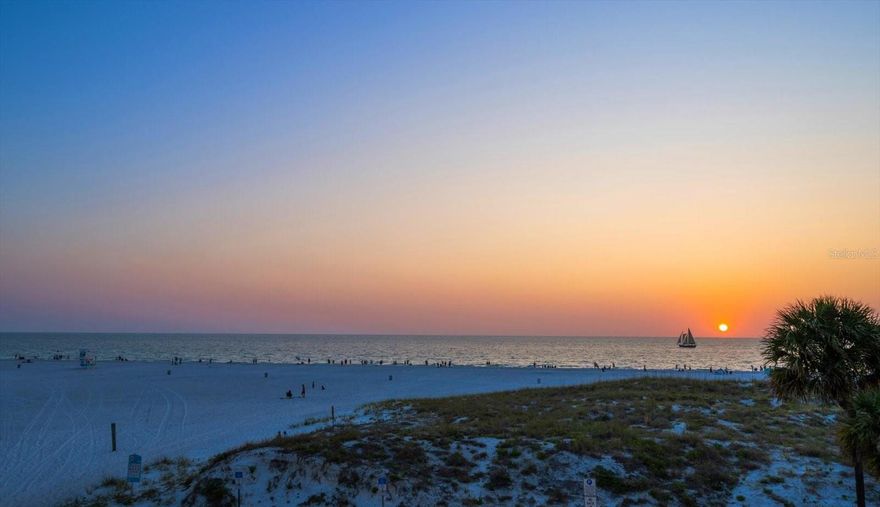 Welcome to a wonderfully unique blend of serene, luxury beachfront living and area vibrancy…welcome to Pura Vida Residences. Built in 2020, this coastal sanctuary consisting of 22 private residences is one of the most recently constructed buildings in the area and sits at the tranquil, north end of award winning Clearwater Beach, yet is within easy access to shops, marine and beach activities, plus numerous restaurants, including fine dining for those special moments and casual beachfront establishments for enjoying the flip-flop life. One of the largest floor plans in the building with 2,618sf, 10’ ceilings, open floor plan living space and split plan bedroom layout, unit 301 is an exquisite and spacious SW corner residence offering comfort, style and refined living. Direct West facing, floor to ceiling impact windows, sliders and glass paneled balconies allow an abundance of natural light and seamlessly blend beach and Gulf of Mexico views from the entire kitchen, living and dining space, primary and second bedroom…offering a front row seat to possibly some of the most spectacular sunsets you will ever see. Secure elevator access leads to a private foyer, and custom mahogany double doors welcome you to a very special residence where every detail has been custom crafted, professionally designed and exquisitely decorated to offer the ultimate coastal retreat. Please request the full feature sheet to fully appreciate all offerings and owner upgrades including a stunning, built-in, live-edge, one piece Acacia wood desktop from Costa Rica, wainscoting, crown molding, designer wall coverings, custom closets, quartz waterfall kitchen island, Miele appliances, 5 burner gas stove, whole unit water filtration and softener, reverse osmosis filtration at the kitchen sink, consistent tile flooring throughout, smart home components featuring keyless entry, surround sound media center, camera system, motorized (with remote capability) Hunter Douglas window shades, plantation shutters, customizable electric fireplace, frame TV…and so much more! Private, climate controlled, 8x8 (approx) storage unit. Secure, gated entry to the building, 2 assigned under building parking spaces (pre-wired for an electric vehicle charging station) conveniently located close to the lobby access. Personal beach locker for easy access to fun in the sun at your doorstep. Building amenities include heated pool with flow resistance, spa, club room, fitness center, indoor bike storage, key fob and digital security for doors and elevators, back-up generator and 24-7 video security. Pro-active and professionally managed Association. Pet friendly building (1 pet under 35lbs). One month minimum rental. This is a fantastic opportunity to make this slice of elegant paradise…yours!