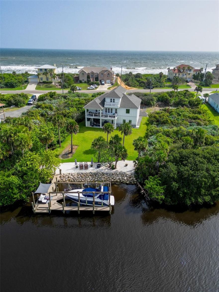 Welcome to your dream waterfront oasis in Flagler Beach, Florida! 
Immerse yourself in the soothing sounds of crashing waves and embrace breathtaking panoramic views of both the Atlantic Ocean and the Intracoastal Waterway. This newly constructed coastal masterpiece invites you to experience the ultimate beachfront lifestyle.
 5 Bedrooms, 3.5 Baths: This spacious home offers room for the whole family and guests, with five well-appointed bedrooms and three and a half luxurious bathrooms.
 4-Car Garage: Park your vehicles with ease in the expansive 4-car garage, providing ample space for all your beach toys and essentials.
 Porches Off Every Bedroom: Wake up to the fresh sea breeze and enjoy your morning coffee on private porches attached to each bedroom, creating a personal retreat for everyone.
 Downstairs Apartment/In-Law Suite: Perfect for guests or extended family, the downstairs apartment offers a separate living space with all the comforts of home.
Elevator: Accessibility is key, and this home features an elevator for convenience, ensuring that every part of your coastal retreat is easily reachable.
 Storm Shelter: Your safety is a priority, and the first-floor storm room, with its 4" concrete ceiling and poured block walls, provides peace of mind during inclement weather.
 32-Foot Boat Slip: Boating enthusiasts will delight in the convenience of their own 32-foot boat slip, allowing easy access to the water for endless adventures.
 Decks with Breathtaking Views: Experience the serenity of breezy afternoons from your expansive decks, where every moment becomes a picture-perfect memory.
Fireplaces: Cozy up on chilly nights with the warmth of a gas fireplace in the great room and an electric fireplace in the master bedroom.
 Unparalleled Luxury: There's truly nothing like this coastal gem in Flagler Beach—indulge in the epitome of luxury living with unparalleled features and design.
 Schedule your Showing Today: Don't miss the opportunity to make this exceptional waterfront home yours. Schedule your showing today and embark on a new chapter of coastal living in Flagler Beach!