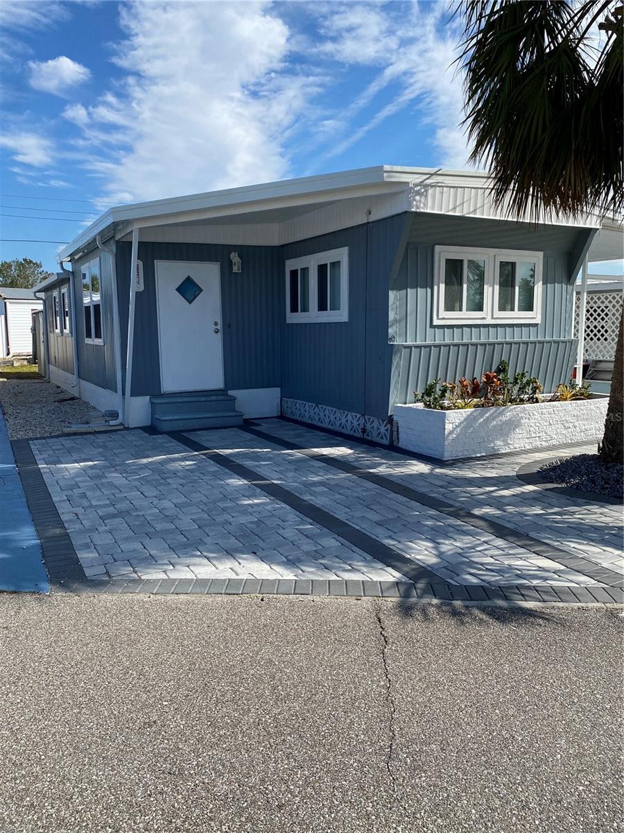 This wonderful 3 bedroom 2 bath home with an open floor plan was beautifully remodeled in 2022 and is part of the highly sought-after Trailer Estates Community directly on Sarasota Bay. Trailer Estates, a marina chartered special recreation district, is special in so many ways including the fact that owning in Trailer Estates means owning the land beneath your home (No lot rent!) Even rarer is the fact that this spacious double-wide has 3 bedrooms as well as 2 baths. There is plenty of room for entertaining and coastal living. Furnishings are included. In addition to the marina where residents may rent their own boat slips, the community has a private beach, a pool, a hot tub, a community center, exercise facilities, a wood shop, numerous clubs and activities such as shuffleboard, kayaking, pickleball, horseshoes, bocce, dancing, art classes, card games, bingo, and so much more. There is a Post Office within the community and a shopping center with restaurants adjacent to the community, commonly accessed by a golf cart. Trailer Estates is an age-restricted 55+ Community. Deed restrictions and Rules and Regulations for Owners apply. Trailer Estates is a Special Park and Recreation District which is a self-governing special tax district under Chapter 418, Florida Statutes. The annual fee of $1,610 covers cable, internet, trash pickup, fire and rescue, park manager, pool, recreational facilities and activities.