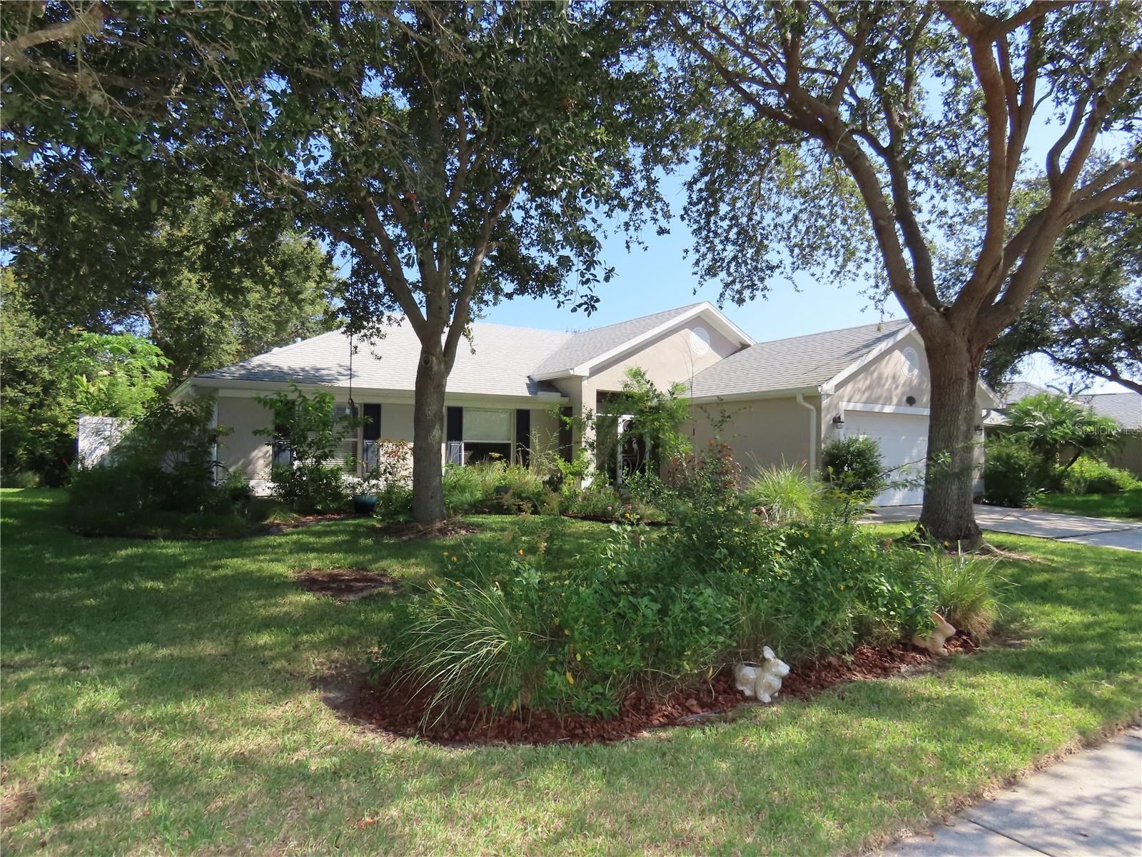 Immaculate, well maintained 4br/2ba home conveniently located in Oak Grove subdivision. Easy commute for Northrop Grumman and L3Harris employees. Minutes to Melbourne Beach, Airport, 95, shopping, schools, library and parks. This unique property backs up to the Nature Preserve - so no building behind you; yet enjoy the beauty of nature and the sounds of song birds. The fenced backyard is a gardeners delight. Soil filled Birdies raised garden beds set up with drip irrigation; ready for homegrown healthy vegetables. Also, pick fresh fruit from the numerous trees - banana, papaya, mulberry, cherry, lemon, just to name a few. You will appreciate the low maintenance luxury vinyl flooring through out the inside of this thoughtful open floor plan. The kitchen allows for great site lines into the living and dining room. Spacious bedrooms. Inside laundry room with plenty of shelves for storage. Two covered screened porches - one in the front and one in the back. The extended open paver patio perfect for grilling out gives additional entertaining space. The beautifully designed Florida native landscape in the front yard along with the majestic oak trees for shade says Welcome - You Are Home! Architectural Shingle Roof, Gutters, Downspouts, Water Heater w/Expansion Tank, Stainless Steel Kitchen Appliances, Interior/Exterior Painting all completed recently. Ready for you to move right in! The community offers a fenced in playground and basketball court. Everything you are looking for. You won't want to miss out. Call today!