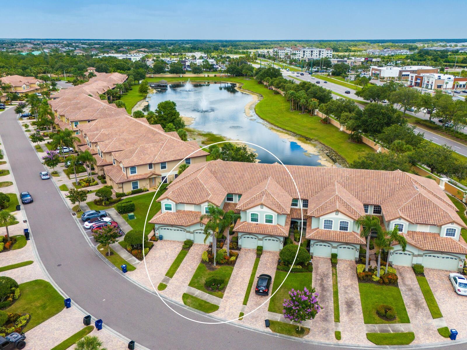 Welcome to this 2 BR, 2 Bath, plus den beautifully updated ground floor END-UNIT condo in Miramar, ideally situated in a premier location with long water and fountain views. From the moment you step inside, you’ll notice the thoughtful updates, elegant finishes, and inviting spaces that make this home truly move-in ready. A host of architectural details include tray ceilings in foyer and dining room, crown molding throughout living area and Owner’s Retreat, rounded corners and freshly painted interior. This stunning unit features new laminate flooring in the living room, dining room and primary bedroom, along with new carpet in the guest bedroom and den. The spacious and newly remodeled kitchen is a true highlight, boasting quartz countertops, soft-close cabinetry with pull-outs, a gas range, stainless steel appliances, designer backsplash, under-cabinet lighting, and upgraded sink and faucet. Pamper yourself in the spa-like primary suite offering a large walk-in closet, dual vanities, comfort-height toilet, separate shower, and a relaxing garden tub. Additional features include a screened porch overlooking the lake, new tankless hot water heater (2023) newer A/C (2019), tile floors in foyer, kitchen, baths, and laundry, and a laundry room with upper cabinets. The garage includes built-in cabinet storage and painted floor. Mature landscaping, tasteful window treatments, exquisite light fixtures, and fire sprinklers throughout complete this charming home in a sought-after location. Enjoy amenities galore at Miramar, including a large, heated pool and spa, spacious clubhouse with a full kitchen, conference room, well-equipped fitness center, outdoor BBQ, and dock with gazebo to capture serene sunsets. Ideally located to I-75, the Sarasota and Tampa Airports, University Town Center Mall, Lakewood Ranch Main Street and Waterside dining and shopping, too many golfing venues to list, and a myriad of renowned Gulf Coast beaches. Whether you are seeking a leisurely day at the beach or a vibrant night out on the town, the possibilities are endless in this coveted Lakewood Ranch community. Paradise awaits!