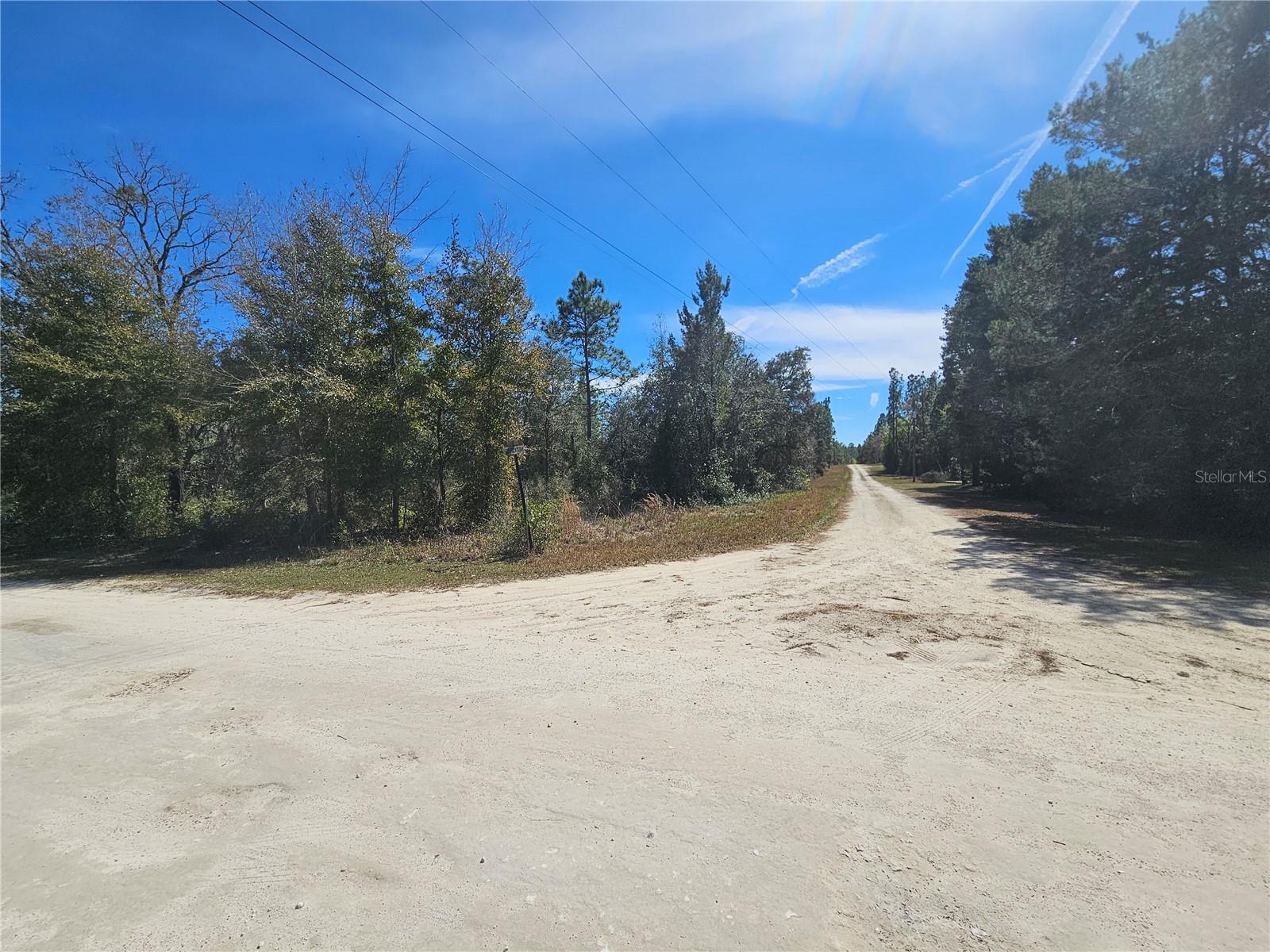 WILLISTON HIGHLANDS 1 ACRE CORNER BUILDING LOT. Just 10 minutes south of town off State Road 121 in Williston. 1 acre parcel measures approximately 210' x 210'. Zoned for manufactured or site-built homes. Just minutes from Williston Airport and Goethe State Forest. This beautiful lot in Williston Highlands Unit 14, with easy access to Ocala, and Gainesville is high & dry, with no HOA and no time limits to build.