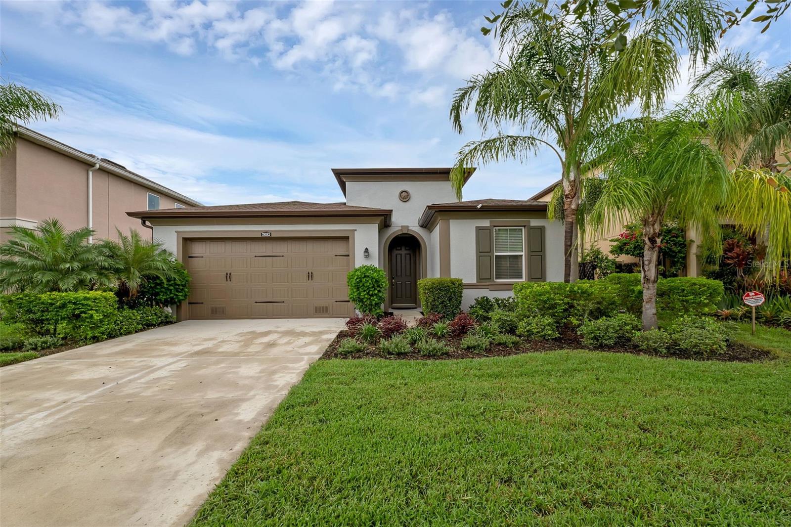 Welcome to the highly sought-after Estancia at Wiregrass community in Wesley Chapel. This stunning Ellison model by WCI/Lennar is an elegant one-story home offering 3 spacious bedrooms, 3 full bathrooms, a dedicated office, and over 2,300 square feet of thoughtfully designed living space. As you enter, you're greeted by an airy open floor plan featuring tile and laminate flooring, and abundant natural light throughout. The gourmet kitchen boasts a massive island, walk-in pantry, built-in double ovens, gas cooktop, and solid surface counters—perfect for the home chef. The primary suite is a true retreat with a large walk-in closet, garden tub, dual vanities, and a separate shower.
Need to work from home? The private office with double doors provides the ideal quiet space. Step outside to the covered lanai and enjoy a peaceful pond view—a perfect backdrop for your morning coffee or evening relaxation. Additional highlights include a spacious laundry room, a two-car garage, fresh interior and exterior paint, and brand new carpeting in all bedrooms. Located on a quiet dead-end street, this home also offers access to resort-style amenities including a pool, fitness center, park, playground, and tennis courts.
This beautifully maintained home is minutes from top shopping and dining destinations, major commuter routes, and highly rated schools. The Estancia community combines elegant living with modern convenience and natural beauty.
Schedule your private showing today and make this incredible home yours!