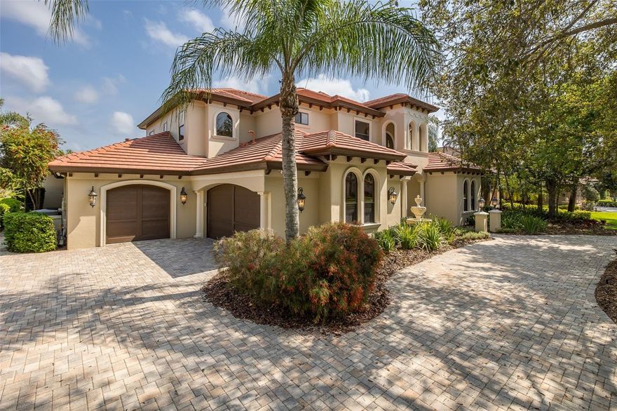 One or more photo(s) has been virtually staged. Welcome to Champions Club — Where Luxury Meets an Unrivaled Setting Nestled on one of the most coveted lots in the desirable Champions Club community, this breathtaking custom Campagna home offers a rare combination of water and golf course views along the prestigious Fox Hollow Golf Course. Spanning an impressive 4,657 square feet, this architectural masterpiece delivers 4 bedrooms, 3 full baths, 2 half baths, a private study, bonus/game room, and an upstairs loft — a thoughtfully designed home that effortlessly balances grand entertaining with everyday comfort. Step inside and be immediately captivated by the formal living room’s soaring ceilings, custom gas fireplace, and stunning travertine flooring. The formal dining room offers an elegant setting for entertaining, complete with an adjacent butler’s pantry. The custom gourmet kitchen is a chef’s dream, equipped with top-of-the-line appliances, a custom hood, 6-burner gas cooktop, and a spacious walk-in pantry. A sunny breakfast nook overlooks the sparkling pool — the perfect spot to start your morning. The warm and inviting family room impresses with a custom coffered ceiling, gas fireplace, and rich hardwood flooring, creating the ideal gathering space for family and friends. The bonus/game room, adorned with gorgeous wood accents, is the ultimate hangout destination. The first-floor primary suite is a true retreat, offering a private sitting area with stunning pool and golf course views. The spa-inspired en suite bath pampers with his and her vanities, a custom shower, a relaxing soaking tub, and two spacious walk-in closets. A private study located just off the primary suite provides a seamless transition to a dedicated home office. A half bath and a roomy laundry room complete the first floor. A breathtaking wrought iron and wood staircase leads to the second floor, where three oversized bedrooms — each with walk-in closets — await. One features its own private en suite bath, while the other two share a well-appointed Jack & Jill bathroom. An upstairs loft with a wall of custom bookcases serves as the perfect reading nook or second office. Step outside onto the rooftop balcony and take in the sweeping views — the ideal place to unwind at the end of the day. Additional highlights include a newer HVAC system, solid wood doors throughout, exceptional custom millwork and architectural detailing, and a BRAND NEW ROOF. This extraordinary home sits on ONE OF THE MOST PREMIUM LOTS in all of Champions Club, offering unobstructed water and golf course views that simply cannot be replicated. Champions Club is a Premier Golf Course Community, Conveniently Located Close to Many Shops, Restaurants, Medical Facilities, Short Drive to Many Local Beaches, Short Drive to Tampa International Airport, Clearwater/St. Pete Airport & Much More! Zoned for Excellent Trinity Schools! ~ Trinity Elementary * Seven Springs Middle * J.W. Mitchell This is not just a home — it is a lifestyle!