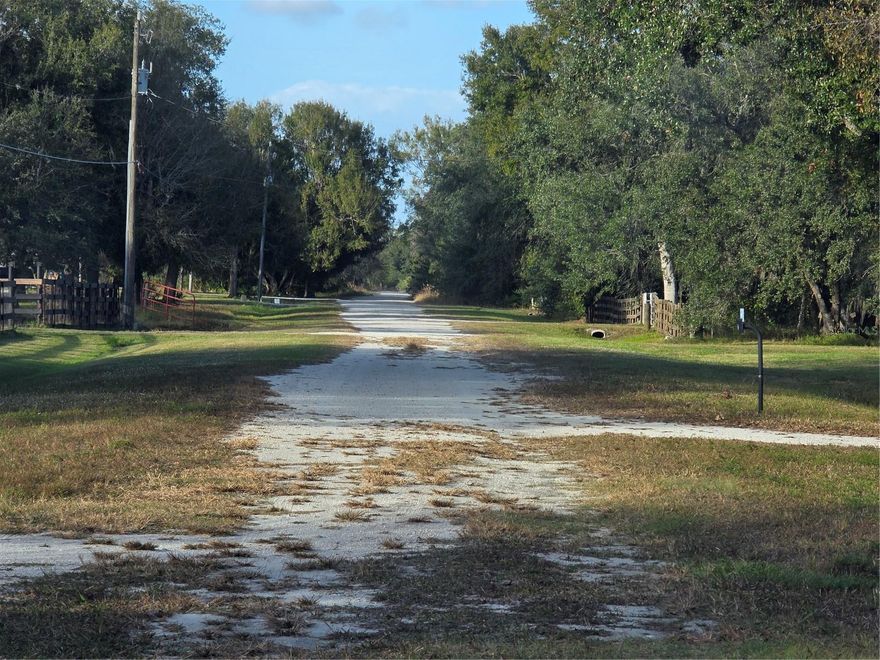 One-of-a-kind, non-flood zone acreage parcel with all improvements recently completed. This quiet parcel is at the dead end of the road, backing to a large sod farm with a high 6-foot berm separating properties adding even extra privacy. Featuring a new 300 ft. deep well and pump house, complete 5 strand barbwire entire perimeter fencing with newly installed 40-foot entrance culvert and 40ft. gated entrance. Over 1/2- 2/3 acres completely cleared at entrance, filled and topped with 4-5 inches of hard packed shell drive. More than enough area to accommodate even the largest R.V. Power recently connected and set up with 220 R.V. power hook ups. Many large mature oaks remain in rear of property yet can still drive over entire parcel. A5 zoning allows for manufactured homes, and a multitude of agricultural activities including livestock grazing, gardening, horses, etc. Perfect size to build on and still have a manageable mini farm. Many other existing improvements also included on site including 2 livestock pens at rear of parcel, 2 raised 300-gallon water tanks, feeders, etc.  Well over $35,000 in completed improvements on parcel over the past year, all the site work done, whether to build a new home, barndominium, R.V storage, or to use as a weekend campsite, this peaceful AG property is ready for your use.