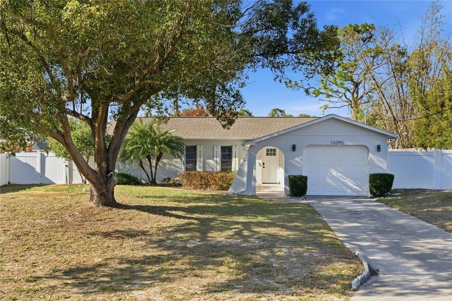 Welcome to this completely renovated 3-bedroom, 2-bath pool home in Spring Hill. The open-concept living, dining, and kitchen areas create a bright and inviting space, perfect for everyday living and entertaining. The kitchen features custom cabinetry, quartz countertops, stainless steel appliances, and an eat-in bar for additional seating. The primary suite offers an en-suite bathroom with a walk-in shower and updated vanity with ample storage. Two additional bedrooms share a tastefully updated bathroom with a tub/shower combination. Enjoy Florida living from the large screened porch overlooking the in-ground pool, patio, and spacious backyard—ideal for outdoor dining or relaxing. Additional features include an attached one-car garage, laundry hookups in the garage, and a roof installed in 2022.