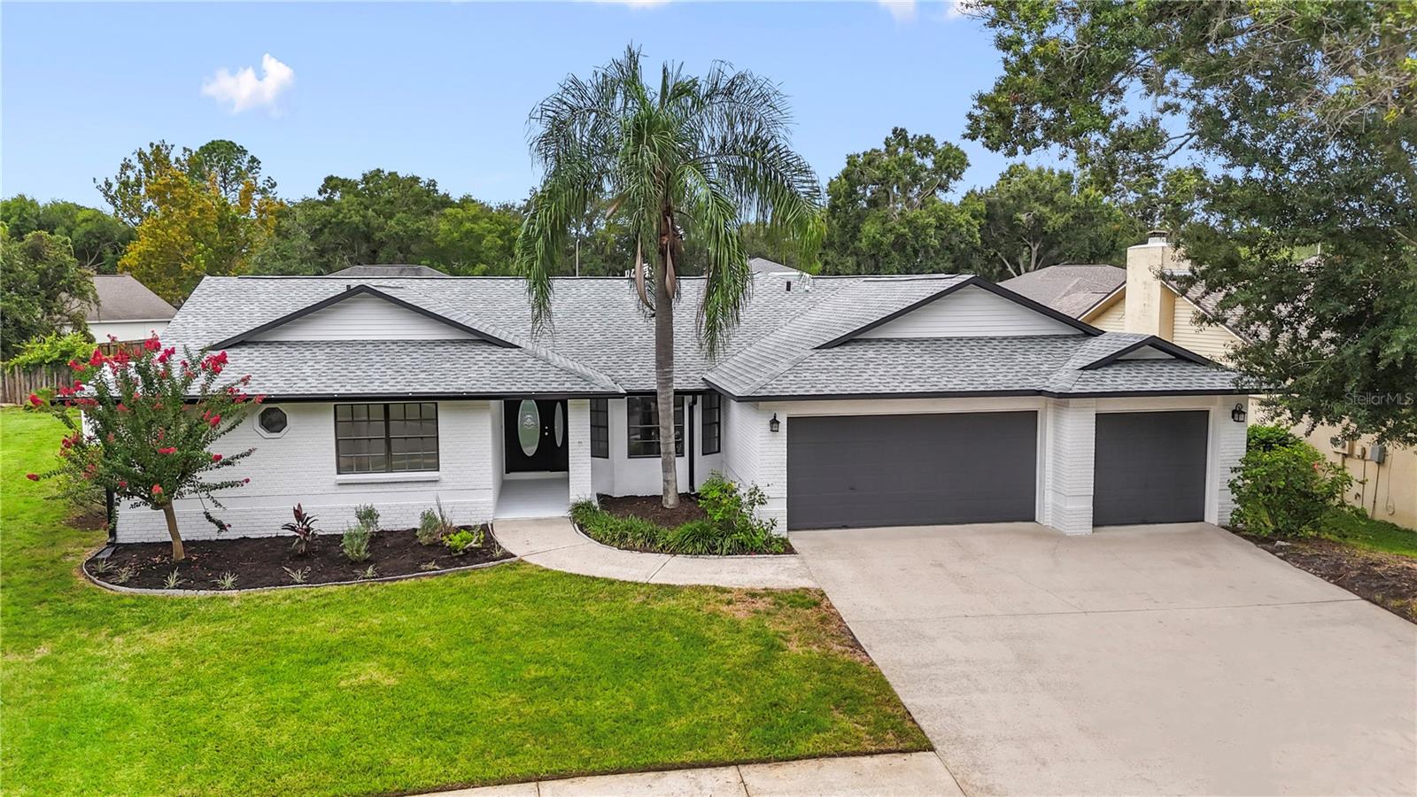 Stunning Renovation in Erin Arbor – Turnkey and Ready for Its New Owner
This beautifully remodeled residence offers a refined blend of modern design and timeless elegance. Thoughtfully updated inside and out, the home is move-in ready and sure to impress even the most discerning buyer. A brand new GAF shingle roof with peel-and-stick underlayment was installed in July 2025, offering both durability and potential savings on homeowners insurance—buyers are encouraged to consult their insurance provider regarding the benefits of peel-and-stick roofing versus traditional systems.
Freshly painted throughout, the home’s interior features Sherwin-Williams’ 2025 trending color “Snowbound,” setting a sophisticated and airy tone across every space. New luxury waterproof vinyl plank flooring extends throughout the entire home, offering both style and functionality. Every interior door has been replaced with sleek two-panel shaker doors, and the trim and baseboards have been upgraded to oversized 6-inch profiles, adding a subtle farmhouse elegance to the interior.
The centerpiece of the home is a beautifully designed kitchen that effortlessly blends form and function. Custom slim shaker cabinetry in white and warm white oak tones provides a modern yet inviting aesthetic. A stunning super-jumbo Carrera-style quartz island comfortably seats up to eight people and anchors the space, while also housing a large farmhouse sink and cabinetry on both sides for exceptional storage. The kitchen is equipped with high-end Samsung Family Hub smart appliances, including a refrigerator, oven, and dishwasher, all compatible with Amazon Alexa and other smart home systems. A tasteful tile backsplash completes the look, creating a truly impressive space for cooking, gathering, and entertaining.Both bathrooms have been fully renovated with luxury in mind. The guest bath features Edward Martin Leona 12x12 matte porcelain checkerboard tile in Calacatta and Amani Grey, a new double vanity, a tiled bath/shower surround, and a generously sized linen and storage closet. The spacious primary suite features soaring cathedral ceilings and a custom barn door that opens to a beautifully appointed en-suite retreat. The primary bath includes a double vanity with a dedicated makeup station, a freestanding soaking tub, and a large dual-faucet shower with a quartz bench, all enclosed in frosted frameless glass. Coordinating Edward Martin designer tile carries throughout the space, adding a spa-like atmosphere. Dual walk-in closets complete the owner’s suite, offering ample storage and convenience.Outdoor living is equally impressive. The expansive covered patio and pool deck have been resurfaced in a sophisticated grey stone concrete finish. The patio area includes both plumbing and electrical connections, providing the perfect foundation for a future outdoor kitchen or entertaining space.Located in the quiet and highly desirable Bloomingdale community of Erin Arbor, the home is surrounded by other well-maintained brick exterior residences that reflect pride of ownership throughout the neighborhood. Zoned for top-rated schools, including Bloomingdale High School—ranked second in academic performance across Hillsborough County, just behind Plant High—this location offers exceptional educational opportunities. The area is also seeing strong commercial development, with a new Whole Foods under construction nearby and a variety of shopping and dining options within close proximity.
