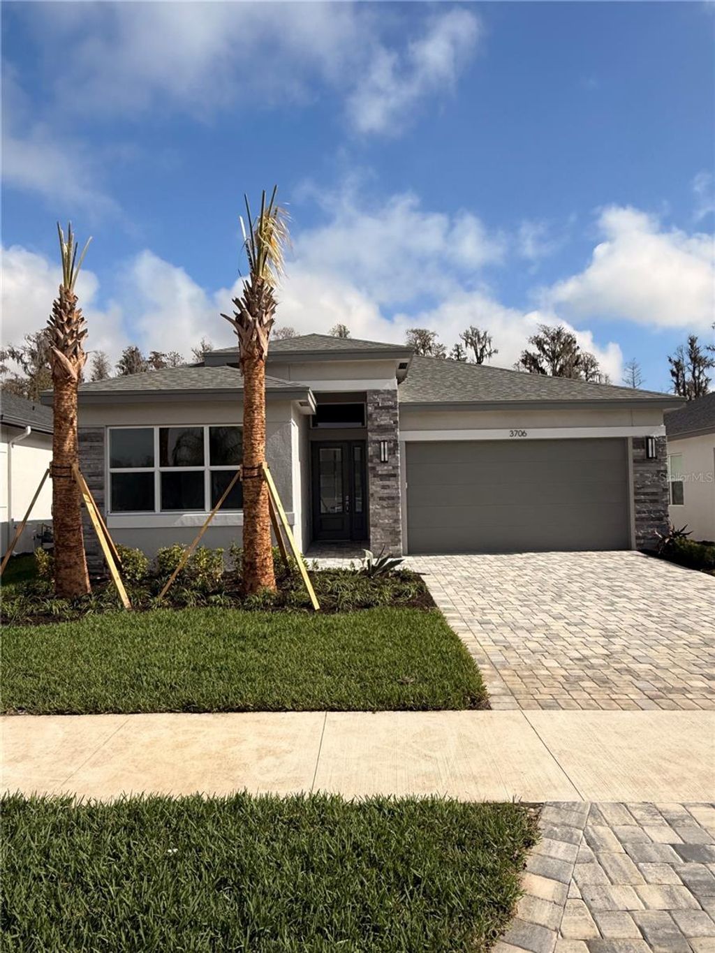 Photo of 3706 Malta Avenue, Wesley Chapel, FL 33543 (MLS # J998842)