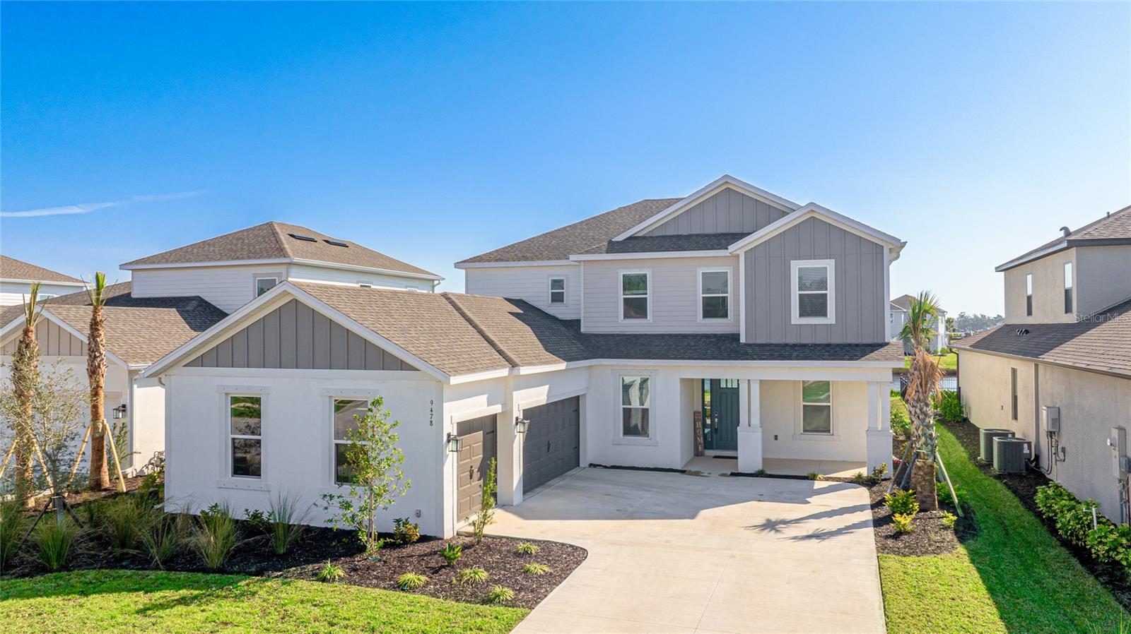 One or more photo(s) has been virtually staged. Welcome to the magnificent, BRAND-NEW Sand Key Model, recently completed this month in the prestigious Skye Ranch community! Boasting nearly 4,000 square feet of sophisticated living, this LAKEFRONT home offers 5 bedrooms, 4.5 baths, a private office, a versatile bonus room, and a spacious 3-car side entry garage. Why wait to build when you can enjoy this brand new home today!
From the moment you enter you'll be greeted by the breathtaking grand staircase and soaring two-story foyer, setting the stage for the luxury that awaits. The sunlit private office, enclosed by elegant French doors, provides the perfect retreat for remote work. Walking into this home presents magnificence with formal dining, expansive foyer, and glimpse to the amazing lake views. Every detail in this home has been thoughtfully crafted, with an upgraded Gourmet Kitchen, wide plank flooring throughout, and designer tile in the bathrooms.
At the heart of the home is a chef’s kitchen, an entertainer’s dream. With a striking center island, GE Café appliances, walk-in pantry, apron front sink, and chic hardware, it combines function with flair. Sparkling quartz countertops seamlessly flow into the backsplash, enhancing the sleek, modern design. Glass sliders lead out to the extended covered lanai, perfect for hosting alfresco dinners or relaxed gatherings.
The primary suite on the main floor offers its own set of extended glass sliders, inviting you to enjoy seamless indoor-outdoor living. Its spa-inspired bathroom features Carrara tile floors, a frameless glass-enclosed rain shower, and a tranquil ambiance—a true sanctuary.
Additional main-floor highlights include a guest powder bath and a well-appointed laundry room with extra shelving for storage. With nearly 1,600 sqft upstairs, you'll find 4 appointed bedrooms, a 21' x 19.5' Game Room which provides more flexible living space, with two with ensuite bathrooms and massive walk-in closets.
This exceptional home has plenty of room for a pool, giving you the option to enhance your lifestyle even further. Skye Ranch, a gated community surrounded by nature trails and preserves, offers access to top-rated schools and is minutes from the iconic Siesta Key Beach. Community amenities include a Newly Opened, resort-style pool, clubhouse, splash pad, tennis courts, fitness center, basketball court, rock climbing wall, café, parks, and a new K-12 school under construction.
Don’t miss out on this remarkable opportunity—schedule your private tour today and experience luxurious living at its finest! Be sure to experience the 3D Matterport Interactive Tour. Why wait to build when you can have BRAND-NEW Construction today!