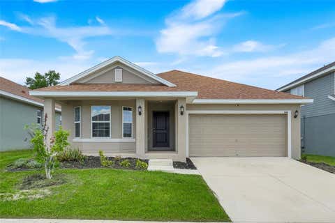 Photo of 140 Krenson Bay Loop, Winter Haven, FL 33881 (MLS # G5113525)
