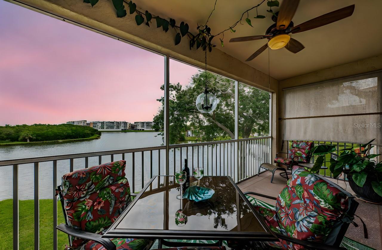 Enjoy easy, maintenance-free living on the water in the guard-gated Shores of Long Bayou. This spacious 3-bedroom, 2-bath, 1,450+ sq. ft. end-unit home offers some of the best lake views in the community, with soaring vaulted ceilings, abundant natural light, and a wall of sliding glass doors opening to a screened balcony overlooking Snowy Egret Lake. Start your day with coffee on the patio, where you’ll catch colorful sunrises, birdwatch egrets and herons, and sometimes even spot an alligator.
The open layout features a generous kitchen with breakfast bar seating, plenty of cabinet space, and views of the water from nearly every room. The primary suite offers balcony access, a walk-in closet with built-ins, and a large en-suite bath with double sinks, walk-in shower, and separate water closet. Two guest bedrooms are split from the primary for privacy. Additional highlights include indoor laundry with full-size washer and dryer, high ceilings, ceramic tile, and a 1-car garage with attic storage. Fresh interior paint and solid construction provide peace of mind.
Shores of Long Bayou spans 77 acres of waterfront preserves, with nearly two miles of nature trails, 25 acres of lakes and ponds, and abundant flora and fauna. Amenities include two swimming pools (one just steps from the unit), a heated pool and spa at the clubhouse, a fitness room, library, hot tub, walking trails, and fishing piers. Monthly fees cover cable, internet, water, trash, exterior maintenance, and reserves, with 24/7 manned gate access.
All this just 7–8 minutes to Madeira Beach, minutes to Seminole City Center and the Pinellas Trail, and only 10 minutes to downtown St. Pete for dining, shopping, and nightlife. Shores of Long Bayou is a pet-friendly, NON-55+ community—one of St. Petersburg’s best-kept secrets.