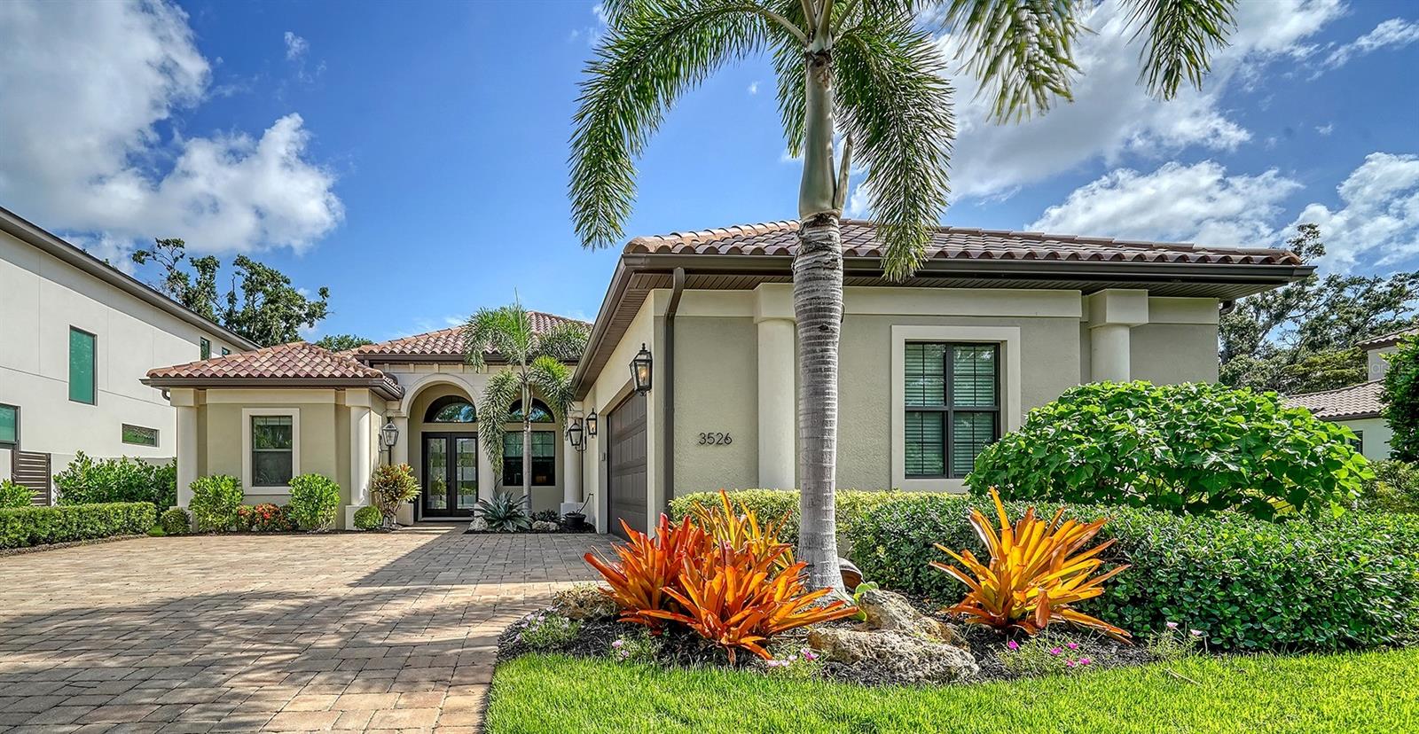 Experience refined living in this custom three-bedroom, three-bathroom PLUS dedicated OFFICE single-family POOL home in The Meadows, one of Sarasota’s most beloved communities—conveniently located near UTC, Nathan Benderson Park, downtown and just minutes to world-class shopping, dining and beaches. Built in 2016 to all updated building codes, it offers impact windows/doors, a whole-house Generac generator, above-flood elevation and a pre-listing inspection with items addressed, so all you have to do is picture yourself here!
Interior features include white oak flooring throughout, pass-through archways, crown molding, upgraded trim and architectural ceilings at no less than 10 feet in height throughout the home. The gourmet kitchen boasts Cambria Brittanicca quartz, Bosch appliances including a 36” induction cooktop with downdraft, convection oven and microwave, warming drawer, and a seamlessly blended walk-in pantry. The oversized island includes hidden magnetic storage, docking drawer, and pull-out cabinetry for ultimate functionality. A Blanco Silgranite sink, Moen touchless faucet, Everpure water filter, and U-Line wine fridge complete the chef’s dream.
Retreat to a luxurious primary suite featuring custom closets with Cambria-topped built-ins, a spa bath with dual vanities, a free-standing tub, a walk-in shower with dual rain and handheld heads, Hansgrohe fixtures and direct lanai access. Both guest bedrooms offer custom closets, with updated guest baths—one featuring a walk-in shower, the other a tub and large storage closet.
Outdoor living shines with a fully equipped summer kitchen (Lynx grill, outdoor fridge, granite tops), saltwater PebbleTec pool with spa and sun shelf under a fully screened lanai. Enjoy a Zen-inspired fenced courtyard garden with turf and paver walkways.
This meticulously maintained and highly upgraded home is a rare find, offering luxury, location and lifestyle in one of Sarasota’s most established neighborhoods. Make your appointment to see it today!
