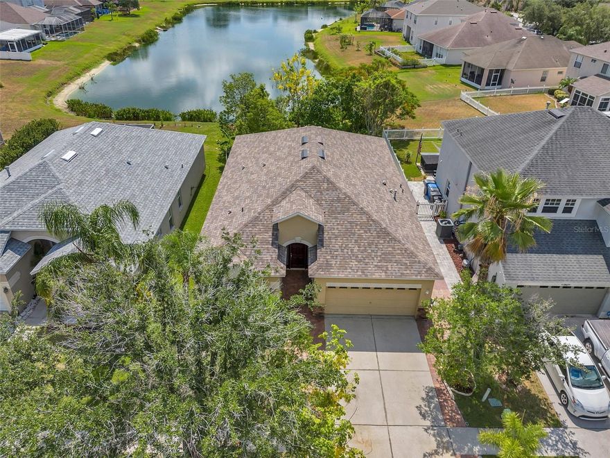 Available 6/1.  Enjoy PRIVATE access to the 80 Acre PRIVATE LAKE MANGO at the highly coveted Estates of Lakeview Village. The community has BOAT RAMP access to WATER SKIING and FISHING on Mango Lake. The OPEN and INVITING home is freshly painted, extra CLEAN, and move-in ready. Come enjoy living at this TROPICAL PARADISE. Spectacular home features 3 bedrooms, 2 bathrooms, and an attached 2 car garage. Step into the spacious foyer and be wowed by the tall VAULTED CEILINGS, OPEN LAYOUT, and view of the pond and tropical landscaping. The living room and dining room are located near the entryway. The dining room has built-in cabinets that can be used as a buffet or serving area, or the space can be used as a home office. The breakfast nook has amazing views of the backyard and can easily accommodate a table for 6. The chef’s delight kitchen has granite countertops, undermount sink, upgraded faucet, custom tile backsplash, and 42-inch upper wood cabinets. The primary bedroom has amazing views of the waterfront and landscaping. The en-suite primary bathroom showcases an impressive walk-in closet, 2 sinks, walk-in shower, separate tub, and private water closet. All bedrooms have ceiling fans with lights. The outdoor living space is sure to impress with a wet bar, covered patio with ceiling fan, expanded concrete patio, and amazing views of the pond and landscaping including avocado, mango, and passion fruit trees. Rare community amenities include a private community boat ramp and picnic tables with BBQ grills. Residents may register to store work trailers or boats (no motorized vehicles). Conveniently located 2 miles from Brandon Mall, restaurants, entertainment, and medical offices, near Interstate I-75 and 3 miles from I-4, and also near the Selmon Expressway. Washer and dryer and lawn service are included with the home.  Available for move-in starting 6/1/2026. Come make this your future home.