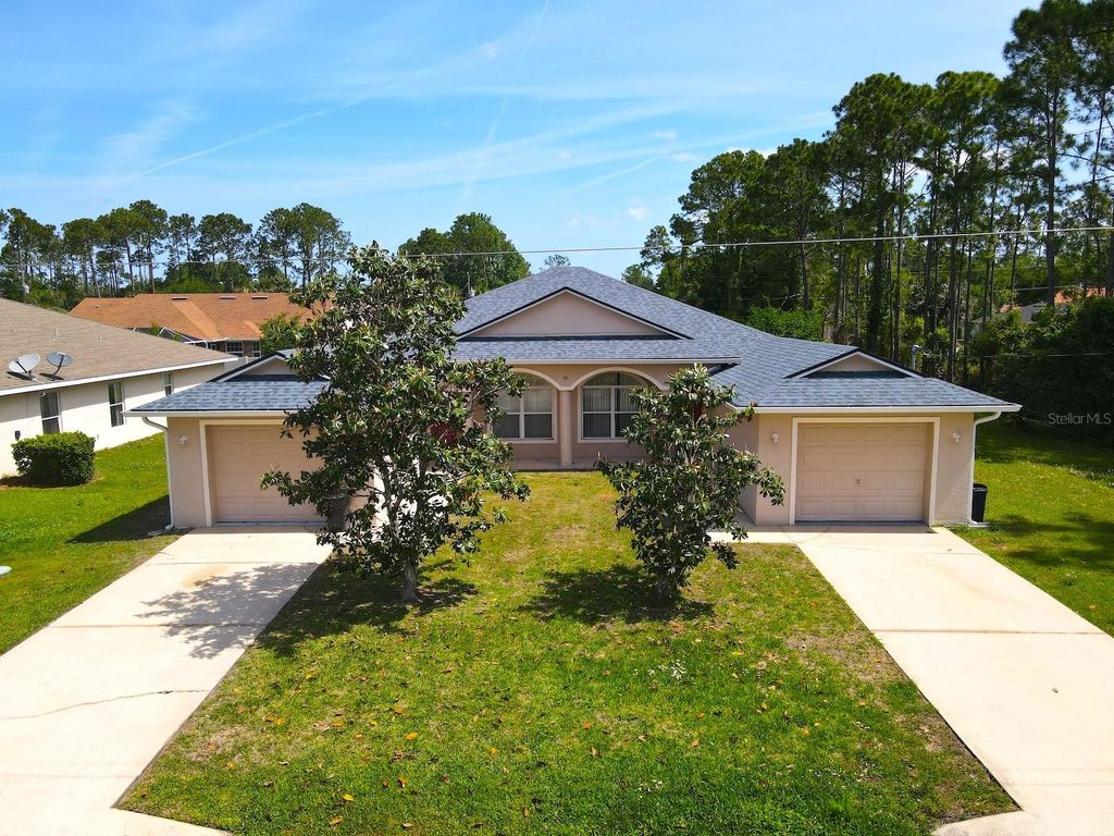Photo of 14 Buttonwood Lane, Palm Coast, FL 32137 (MLS # FC317881)