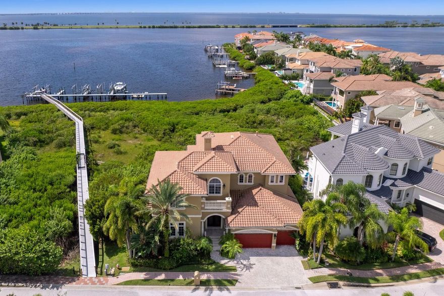 Welcome to one of Tampa Bay's most desirable gated waterfront communities. Positioned on a peninsula of 31 custom estates, The Reserve of Old Tampa Bay provides the perfect waterfront lifestyle for boating enthusiasts, or wildlife spectators. A quiet cove location delivers sweeping water views and superior indoor/outdoor living year round, with 4 bedrooms and 3 full 2 half baths conveniently adjacent to the community dock with designated boat slip/lift. A custom arched leaded glass double door welcomes you to warm wood appointments throughout, with a first level that features a family room with fireplace and corner retracting sliding glass doors to the pool area, along with a formal dining room, gourmet kitchen, wine cellar and expansive media/bonus room with wet bar. The kitchen boasts outstanding water views and provides a center prep island and breakfast bar, Wolf appliances, Sub Zero refrigerator and Miele coffee machine, and integrated appliances. The second level primary suite delivers expansive water views and spa-inspired bath, French doors to the private waterfront terrace, a dual sided fireplace and executive custom closet. This level also features 3 well-appointed ensuite bedrooms with private terraces, a dedicated waterfront office, along with the laundry room. Relax or entertain at the water’s edge with a pool, spa, generous pool deck, covered dining area and outdoor kitchen. Additional appointments include multiple terraces, soaring ceilings and custom plantation shutters throughout, statement lighting, a paver drive and a 3-car garage. Offering easy access to open water, this envied waterfront lifestyle is perfect for boating, fishing and water sports right from your own backyard. Experience distinctive waterfront living and coveted privacy minutes from downtown Tampa, shopping, sports venues, Tampa International Airport and Berkeley Prep School (5 minutes).