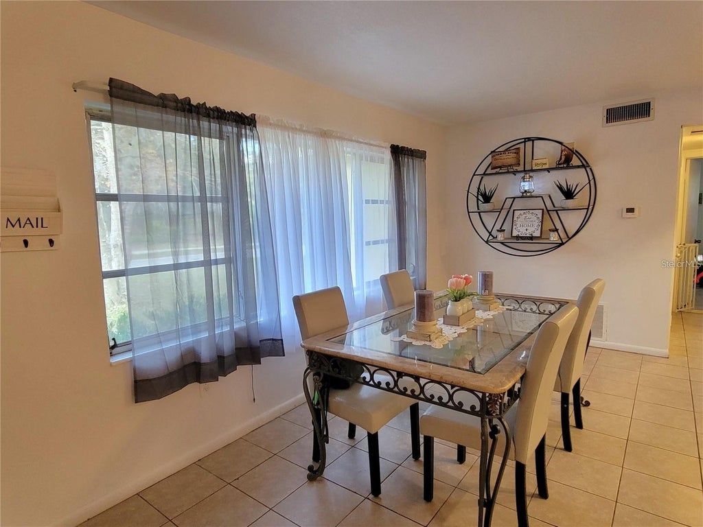 Photo of 906 E Wisconsin Avenue, Deland, FL 32724 (MLS # V4951120)