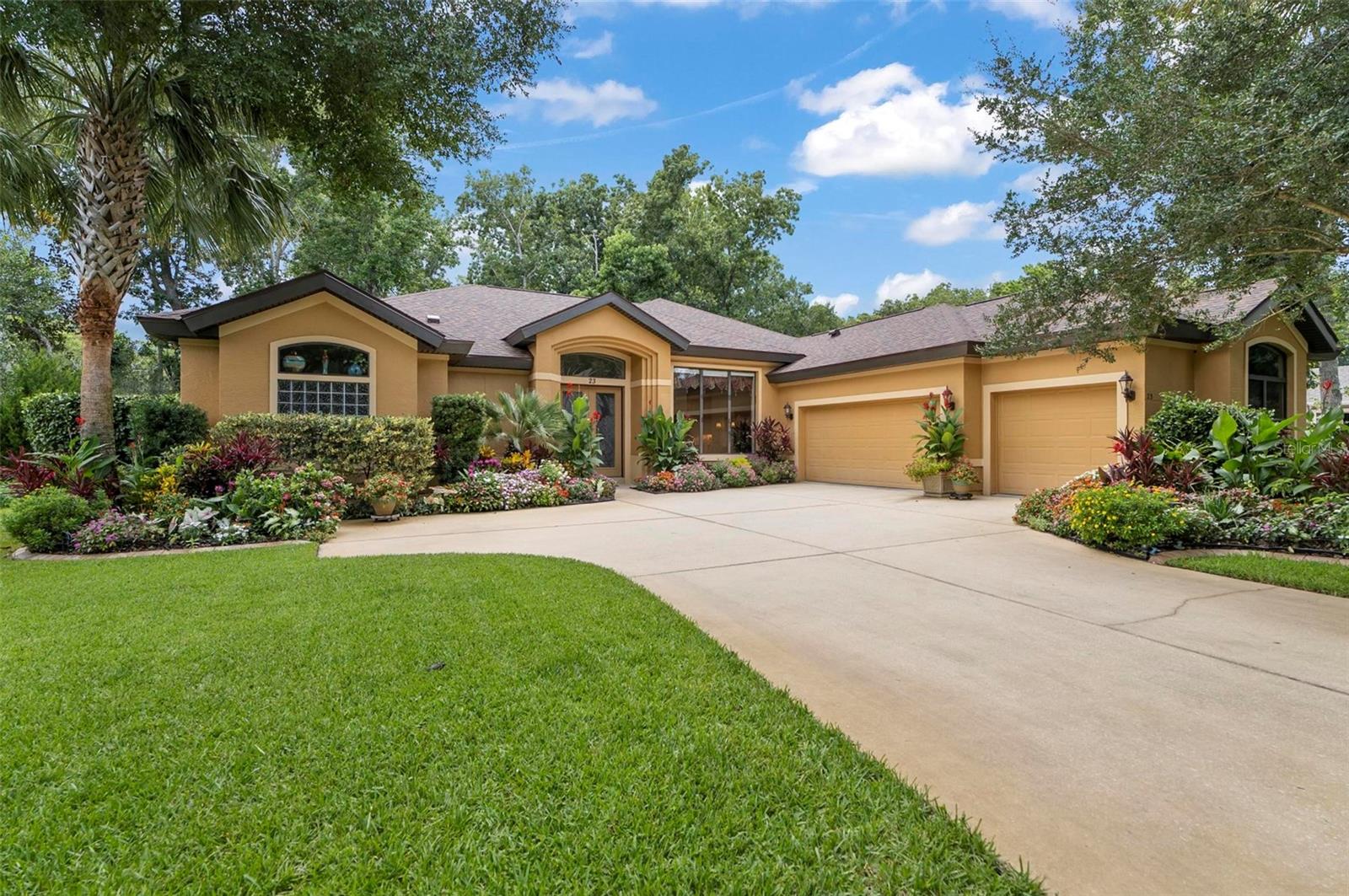You'll be amazed by the beautifully landscaped front garden, impressed by the thoughtfully designed interior layout and features, and absolutely captivated by the serene backyard lake view! ICI Grand Stratford model in fabulous Creekside Village at Grand Haven offers 4 Bedroom, 3 Bathroom, 3 car garage, and 2633 Sqft living space complete with an oversized L-shaped POOL. This gem showcases 12’ceiling in the main living areas and 10’ in the bedrooms. Recent upgrades include a NEW ROOF and interior A/C unit in 2024. Meticulously tended, the property features a split floor plan and includes a formal dining room, family room, and breakfast nook for added privacy. The spacious living room features abundant windows and extra-wide sliding glass doors that flood the space with natural light. The primary suite includes a garden tub, oversized walk-in shower, dual vanities, and a large walk-in closet. Both guest bathrooms are equipped with a walk-in tub and shower combination. The elegant kitchen offers sitting area, 42” cabinets, porcelain tile backsplash, and granite countertop. Throughout the home, you’ll find luxury Tiffany-style light fixtures. Enjoy cozy winter evenings by the beautiful gas fireplace. Additionally, the home is equipped with a water softening system, which is beneficial for your health. Generously sized laundry room offers plenty of shelving and a utility sink. The oversized 3-car garage provides ample space not only for vehicles but also for extra storage, a workshop area, or hobby space—perfect for those who need flexibility and functionality. The pool patio overlooks the oversized, lush green backyard and the tranquil lake view. To enjoy the Florida lifestyle to the fullest, take advantage of the exceptional recreational activities this community offers: clubhouse, 2 public pools, 2 restaurants, fitness center, tennis courts, and countless walking trails with street lighting. If you've ever dreamed of living in paradise—this is your place!