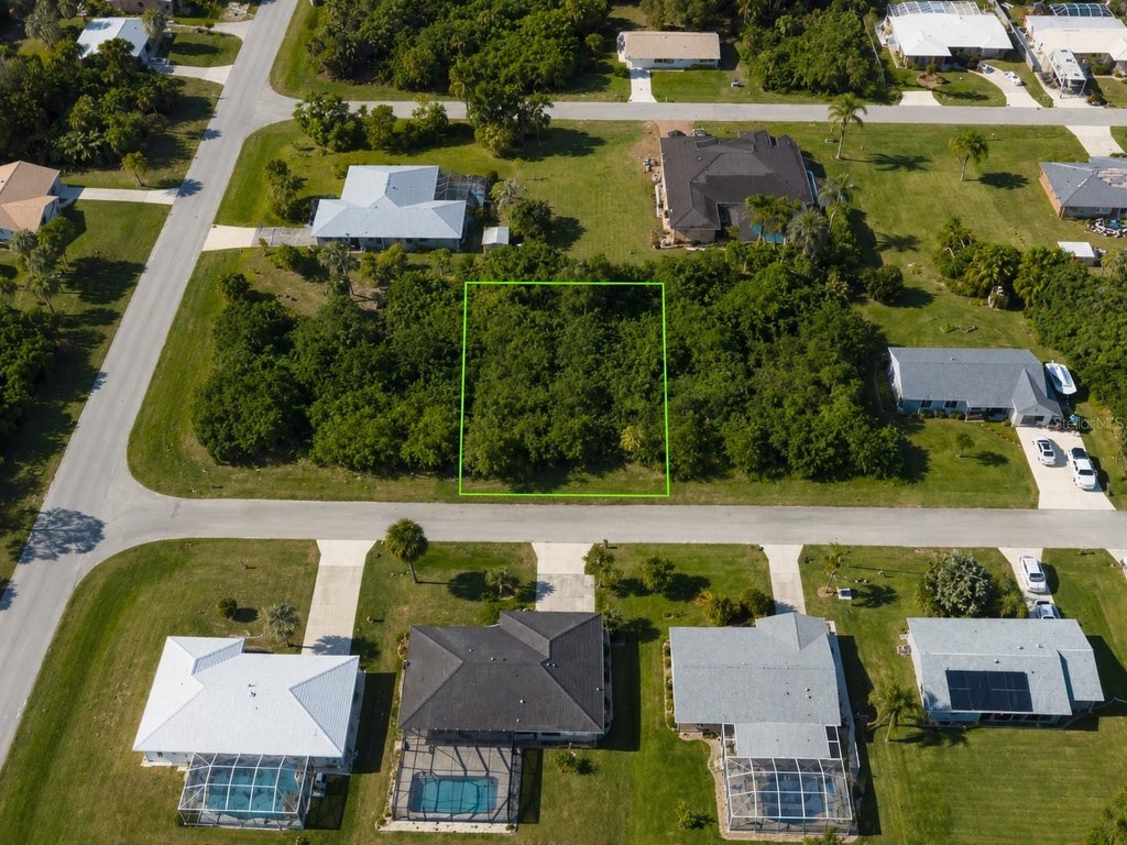 Photo of 4245 Cockrell St, Port Charlotte, FL 33948 (MLS # TB8510945)