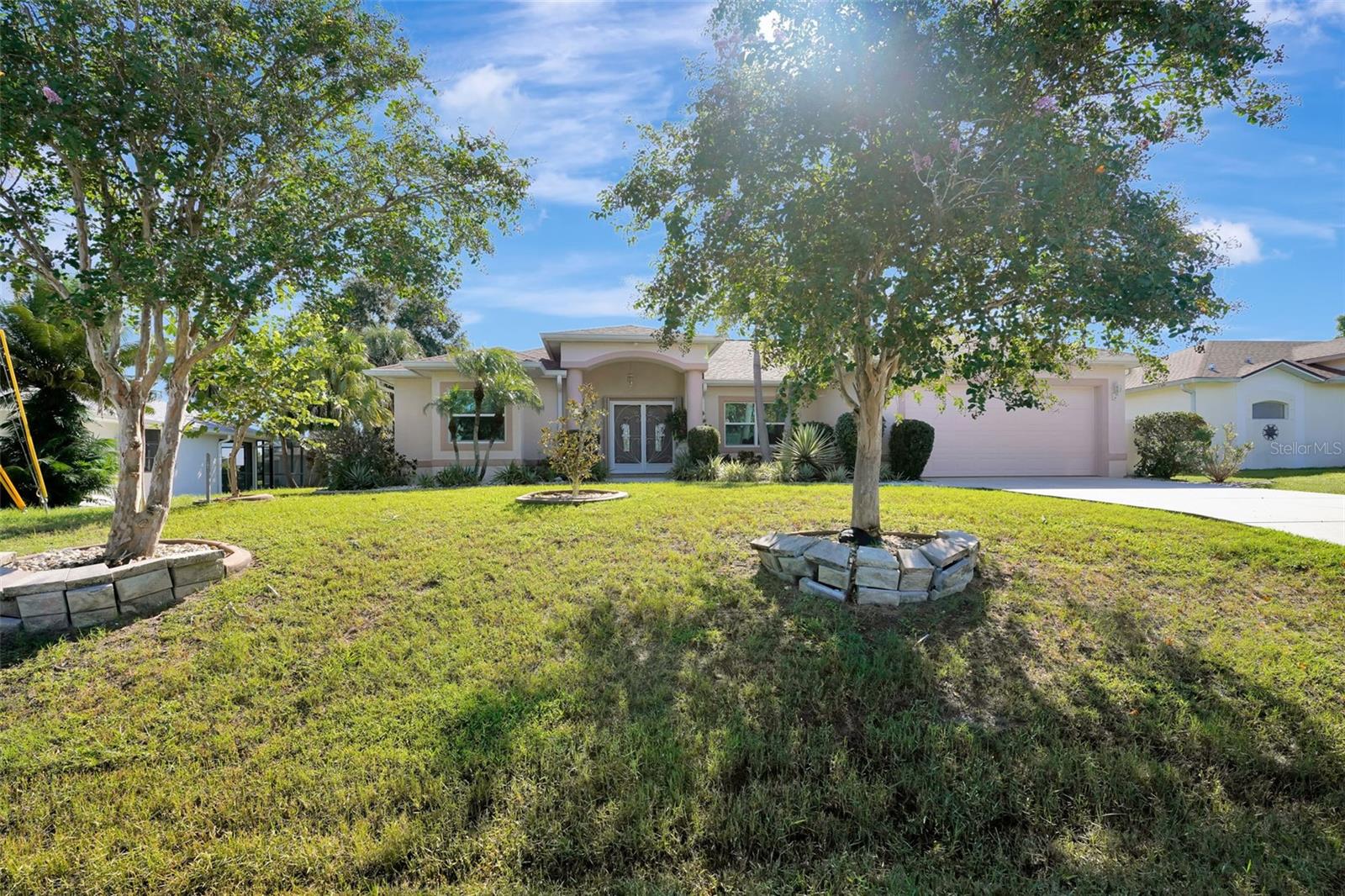 This stunning 2014 home has it all—sleek tile flooring throughout, rich granite finishes, and hurricane impact windows and doors for both beauty and peace of mind. Double leaded-glass doors open to a bright, welcoming foyer, flanked by a formal dining room at the front of the house, an ideal setting for special gatherings. Just beyond is the first of two living areas, perfect for greeting guests or enjoying quiet conversation.
At the heart of the home, the gourmet kitchen shines with solid wood cabinetry, stainless steel appliances, a breakfast bar, and a separate island—making everyday cooking and entertaining effortless. The kitchen flows seamlessly into a spacious family room designed for comfort and connection, with plenty of room to relax or host family and friends.
Step outside to the expansive pavered lanai, where a sparkling resort-style pool with a dramatic waterfall feature takes center stage. A tranquil partial lake view completes the scene, creating a true outdoor oasis for relaxation or entertaining.
The primary retreat is a luxurious escape, offering two oversized walk-in closets, a Roman shower, and a separate soaking tub. Architectural details throughout the home, including custom tray ceilings and arched, tiled bath ceilings, add elegance and timeless charm.
Practical updates provide peace of mind, with a new roof and air conditioning system replaced in 2022 and additional hurricane shutters added in 2016 to protect the lanai area. Flood Zone X - provides additional savings and peace of mind since no flood insurance is required.
Situated in Deep Creek Sec 23, a desirable community in Charlotte County, just across the Peace River from historic downtown Punta Gorda. Surrounded by serene wooded areas, the neighborhood features six freshwater lakes, winding canals, and beautiful natural views. Managed by the Deep Creek Property Owners Association, Sec 23 is designed with spacious greenbelts that enhance drainage while also providing added privacy between homes.
Residents enjoy abundant opportunities for outdoor living—whether it’s spotting wildlife, fishing, tennis, pickleball, basketball, playground, birdwatching, or playing a round at the challenging 18-hole semi-private golf course. While offering a peaceful, country-like setting, Deep Creek also provides convenience, with two exit points close to I-75 and easy access to Port Charlotte and downtown Punta Gorda.
Elegant, functional, and thoughtfully designed, this residence blends sophistication with comfort —ready to welcome you home.