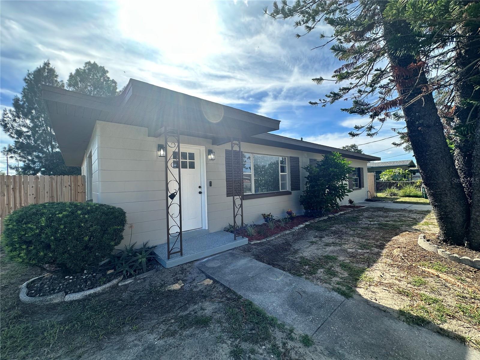 This newly remodeled block home is move-in ready! Recent updates include a new roof, new doors, fresh paint both inside and out, new flooring, and new light fixtures. As you enter, you'll notice beautiful modern porcelain tile flooring throughout the main living areas. The kitchen features all-new cabinets, granite countertops, and stainless steel appliances. Both bathrooms have been fully renovated, with porcelain tile in the showers. The open living space is perfect for entertaining, and the large backyard is private, thanks to a newly installed fence. This property is in a fantastic location on a quiet street in central Winter Haven, offering easy access to shopping centers, restaurants, and entertainment spots. This is a great opportunity to own a 3-bedroom, 2-bath home in a well-established neighborhood with no HOA fees!