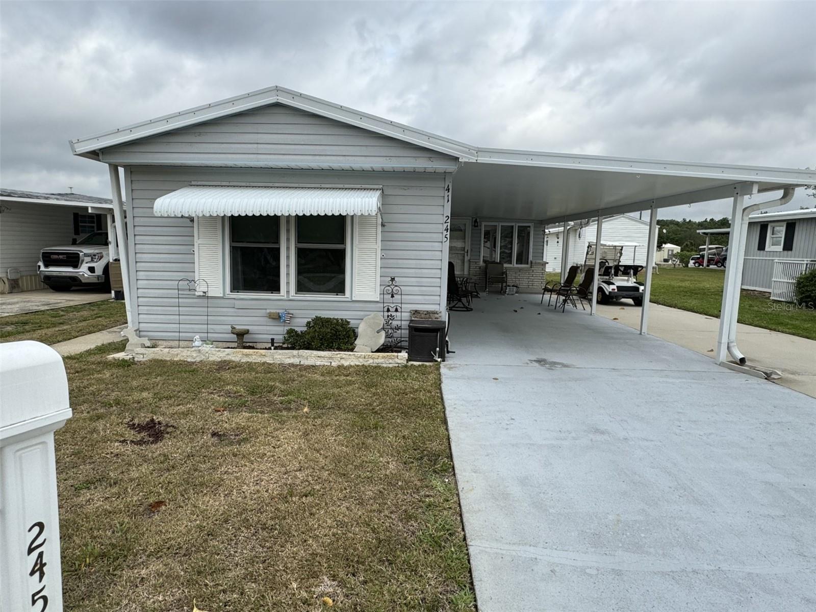 YOU OWN THE LAND! WELCOME HOME TO THIS 55+ Community in rural Lake Wales. 2 bedrooms, 2 bathrooms, large inside laundry/utility room, split bedroom plan, open floor plan, and furnished. Kitchen and Living Room flooring has been upgraded with Luxury Vinyl Plank. The sellers are leaving the golf cart with the property. This home is meticulously cared for, and the rooms are very spacious. This community is quiet, serene and very well maintained. HOA fee includes lawn service, water, sewer, cable and internet, pool, shuffleboard courts, and a clubhouse. Whether you're looking for a seasonal home or a full-time home, this is a definite MUST SEE! Feel like you live in the country, yet you are close to everything such as the beaches on both coasts, theme parks, shopping, medical, gyms, churches, theaters, restaurants, etc. THIS HOME IS MOVE-IN READY and waiting for you!! Call to make your appointment now!!