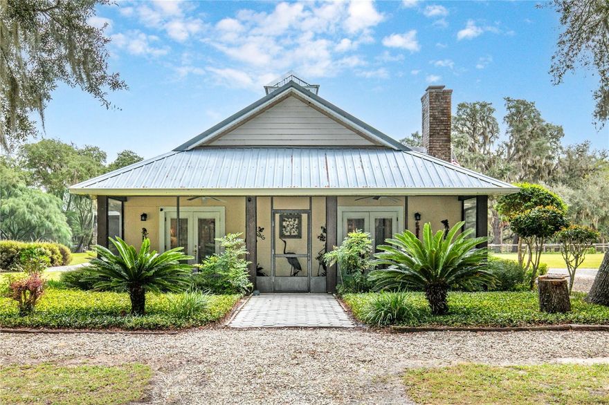 Private 10-Acres of rolling acreage with Barn, RV Pad & Endless Potential. Once in a while you find that tranquil property that is so inviting that it must be seen in person to appreciate the possibilities it offers. 
Set on 10 pristine acres of towering oaks and manicured pastures, this one-of-a-kind property offers unmatched privacy, serenity, and opportunity.
The main home currently features just under 1,000 sq. ft. of finished living space, with an additional 1,000 sq. ft. already integrated and easily converted—bringing the home’s potential to approximately  2,000 sq. ft. with minimal effort. Designed for comfort and efficiency, the home includes a commercial-grade AC system, heavy insulation, and four screened lanais—each offering a unique and tranquil view of the property’s natural beauty.
Outdoors, you’ll find fruit trees, a full hookup RV pad, and a spacious storage garage. The impressive 36x48x14 barn is fully insulated, air-conditioned, and built for versatility, featuring heavy-duty concrete for a lift, 110 amp service, and dual high-lift garage doors—perfect for a workshop, car enthusiast, or agricultural use.
With multiple fenced pastures, this property is ideal for horses, cattle, or any livestock of your choice.
This is more than a property—it’s a lifestyle. Rarely does an estate offer such peace, privacy, and potential all in one place.
 Don’t miss your chance to own this truly unique piece of paradise!