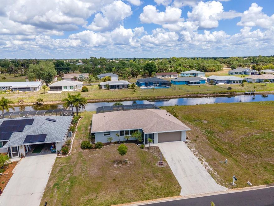 Make your Florida dreams come true with this WATERFRONT home in Rotonda West, where BREATHTAKING WATER VIEWS, a NEW PRIVATE DOCK, and resort-style outdoor living create an unforgettable first impression. This home is designed to stand out, featuring a HEATED INGROUND POOL, OUTDOOR SHOWER, and an OVERSIZED SCREENED-IN LANAI with a PARTIAL COVERED AREA—perfect for entertaining, relaxing, and enjoying the coastal breeze year-round. Enjoy added peace of mind with HURRICANE-IMPACT WINDOWS, a NEWER ROOF, and a desirable location in the X FLOOD ZONE. Simply pack your swimsuits and flip flops and come enjoy this TURNKEY FURNISHED RETREAT. Whether you’re hosting sunset dinners or savoring quiet mornings by the water, this home delivers the lifestyle people move to Florida for.
Inside, the home blends standout features with a smart layout. The SPACIOUS PRIMARY SUITE offers a large WALK-IN CLOSET, a PRIVATE EN-SUITE BATHROOM, and sliding glass doors that open directly to the lanai, bringing the outdoors in. The SPLIT-BEDROOM DESIGN adds privacy, with the second bedroom tucked into its own wing alongside a FULL BATHROOM THAT ALSO FUNCTIONS AS A POOL BATH with DIRECT LANAI ACCESS. The kitchen is both stylish and functional, boasting GRANITE COUNTERTOPS and STAINLESS STEEL APPLIANCES with an easy flow into the main living space—perfect for everyday living and entertaining alike.
Located a short drive from the pristine Gulf shores of Boca Grande Beach and Englewood Beach, this home places you close to some of the best boating, fishing, and beach days Southwest Florida has to offer. Rotonda West is known for its active lifestyle, with multiple GOLF COURSES, parks, and scenic surroundings that make it a highly desirable place to call home. With its combination of key upgrades, thoughtful design, and unbeatable WATERFRONT setting, this property truly stands apart. Call today to view this property and start living the life you deserve!