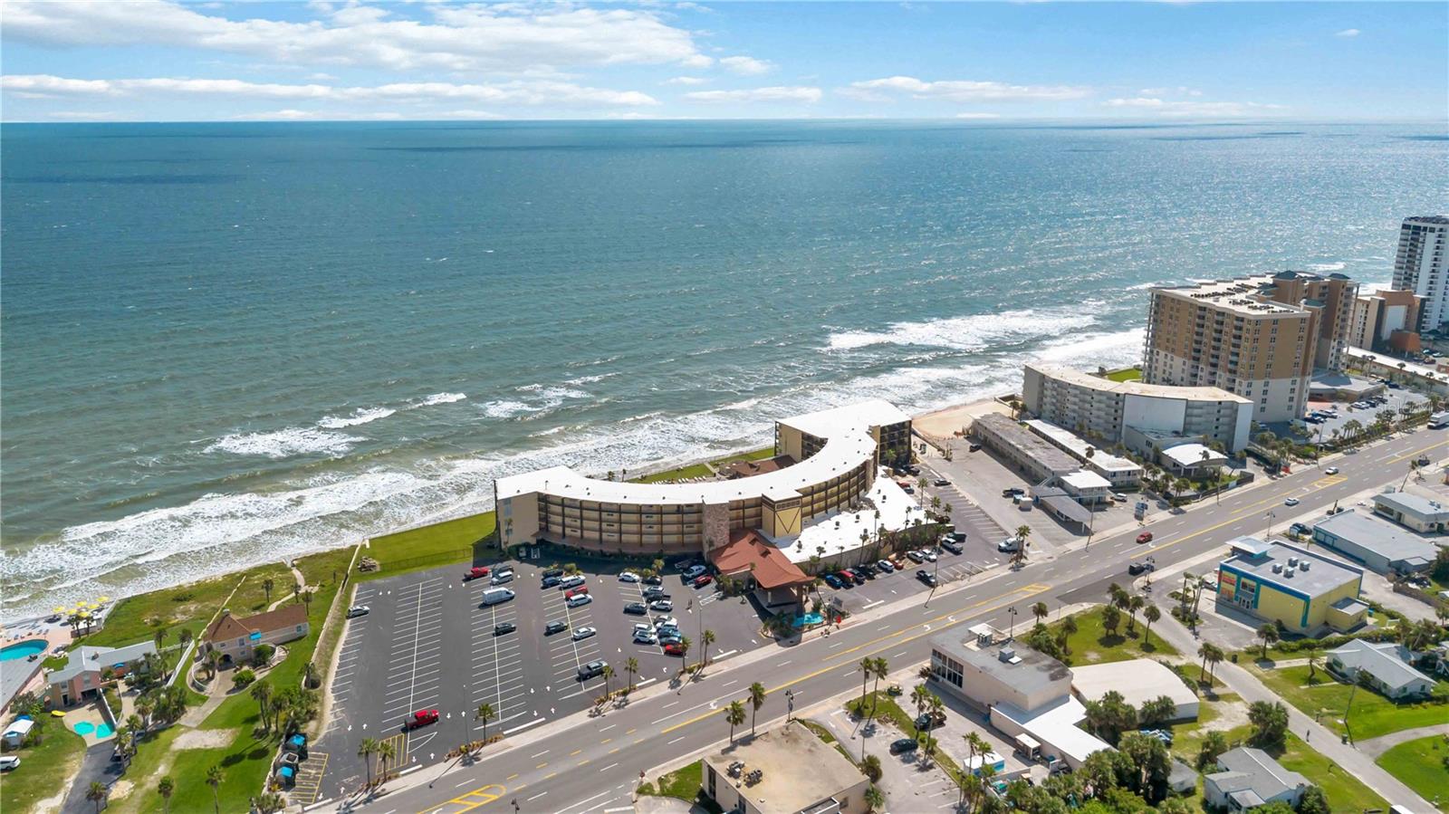 Completely Updated 2-Bedroom, 1-bathroom at the Iconic Oceanfront Hawaiian Inn! This spacious condo offers one of the larger floor plans in the building and features lvp flooring throughout, a fully updated kitchen with stainless steel appliances and granite counters and 2 spacious bedrooms, and a living/dining area with enough space for everyone. Resort-style amenities include a newly refinished Olympic-size oceanfront pool, the famous Tiki Bar, a heated indoor pool, game room, gift shop, and an indoor bar serving excellent food and drinks daily. There's even a 9 hole mini golf course for owners and guests! The HOA fee covers nearly everything—electric, water, internet, cable, building maintenance, pools, front desk, activities, and more—making ownership hassle-free and ideal for a vacation home or investment. Located just 2 miles from the Daytona Beach Boardwalk, Ocean Walk restaurants, Daytona Lagoon, and Main Street Pier, and only 8 miles to the airport and Daytona International Speedway, you’ll be right in the heart of the action. Enjoy the best of coastal living and investment potential at the Hawaiian Inn!