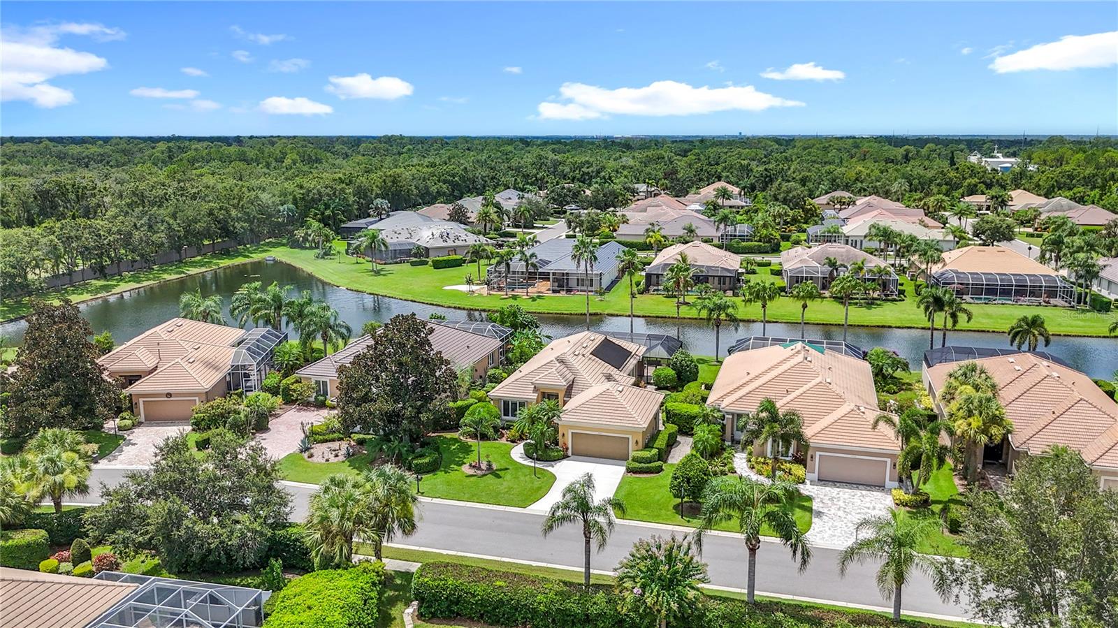 Welcome to Florida Resort style Living within the Prestigious Rosedale Golf & Country Club gated
community. Step inside this beautiful 2Bed,2Bath+Den home to the spacious experience of 12' soaring
ceilings and open concept design. Custom window dressings and shades adorn all windows and glass
doors as wonderful views of nature are invited into the home with an abundance of light. The open floor
plan Kitchen and Walk-in Pantry are complemented by new SS appliances offering inspiration to culinary
dreams and the enjoyment of entertaining hungry guests. Exit the Kitchen to your Private Courtyard
perfect for morning coffee, afternoon grilling (gas grill connection) or private sunning while immersed in
natures greenery. The spacious Living/Dining area opens to a 28' gas & solar heated pool facing south for
optimum shade cover during summer while enjoying serene views of water and palms. Additional features
include retractable storm curtains for all entrances and windows, a custom speaker system in home &
lanai and a 2 car, 1 golf cart garage.
Rosedale is a NON-CDD community with OPTIONAL Country Club Membership granting access to the 18
hole Championship Golf Course, Jr size Olympic Swimming Pool, 5 Har-Tru Tennis Courts, Fitness &
Wellness Center and Full Service Club House for dining and social activities. Rosedale is a short drive from
the Arts & Activities of the Sarasota/Bradenton area and a 35min drive from the beautiful beaches of Anna
Maria Island.
Rosedale HOA fees include such services as Exterior House Painting, Roof Washing, North & South
Manned Security Gates, Common area Maintenance, Mailboxes, Lawn fertilizing-Edging-Mowing, Hedge
Trimming, Tall Palm Tree Trimming, Mulching and Wi-fi & Cable services.
the Rosedale resident experience is a maintenance free lifestyle in a meticulously maintained community.
Come and discover why this home in Rosedale Lakewood Ranch can be the perfect spot to enjoy Resort
Vacation Style Living 365 days a year.