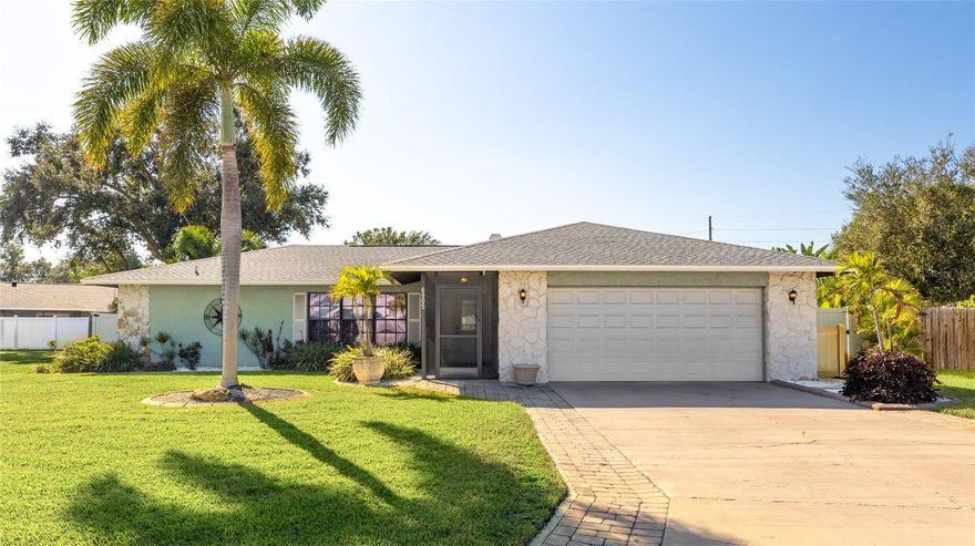 Located just minutes from both the Cortez and Manatee Avenue bridges, this four bedroom pool home sits in one of West Bradenton’s most convenient coastal corridors. Beaches, preserves, and everyday necessities all fall within easy reach, setting the stage for a lifestyle centered around outdoor living and effortless access to Anna Maria Island. The home opens to a bright, inviting interior with an airy living area featuring a wood-burning fireplace and sliding glass doors that frame views of the screened heated pool. Natural light, neutral tones, and updated lighting help the space feel open and cohesive, creating a smooth transition into the dining area and the renovated kitchen. Granite countertops, white cabinetry, pendant lighting, and an extended breakfast bar give the kitchen both style and practicality, while the window over the sink overlooks the backyard’s tropical landscaping. The primary suite enjoys direct access to the pool deck and includes crown molding, wood flooring, and a renovated en-suite bath with a walk-in shower. Three additional bedrooms offer flexibility for guests, home office space, or multi-use living. An indoor laundry room with cabinetry adds convenience. Outdoor living takes center stage in this fully fenced backyard. The new 2025 lanai structure encloses the heated pool and paver deck, creating a generous space for relaxing, dining, and entertaining. Beyond the screened area, mature palms and lush landscaping provide natural privacy around the fire pit and green space. An added benefit for both primary buyers and investors is the option to purchase the home furnished. This creates a seamless move-in opportunity or a turnkey setup for those expanding a short-term rental portfolio in one of the area’s most desirable and well-connected locations. Notable improvements include a 2021 roof, 2024 AC, 2024 refrigerator, 2022 electric pool heater/system, 2025 front screened porch, and a water softener added in 2021. The location is in flood zone D and set on a quiet cul-de-sac, with quick access to Anna Maria Island, Robinson Preserve, G.T. Bray Park, Desoto National Memorial, and nearby shopping and dining. This West Bradenton home blends comfort, upgrades, coastal proximity, and flexible purchase options into an inviting space ready for its next chapter. **THIS PROPERTY QUALIFIES FOR A 1% LENDER INCENTIVE IF USING PREFERRED LENDER. INQUIRE FOR MORE DETAILS.**