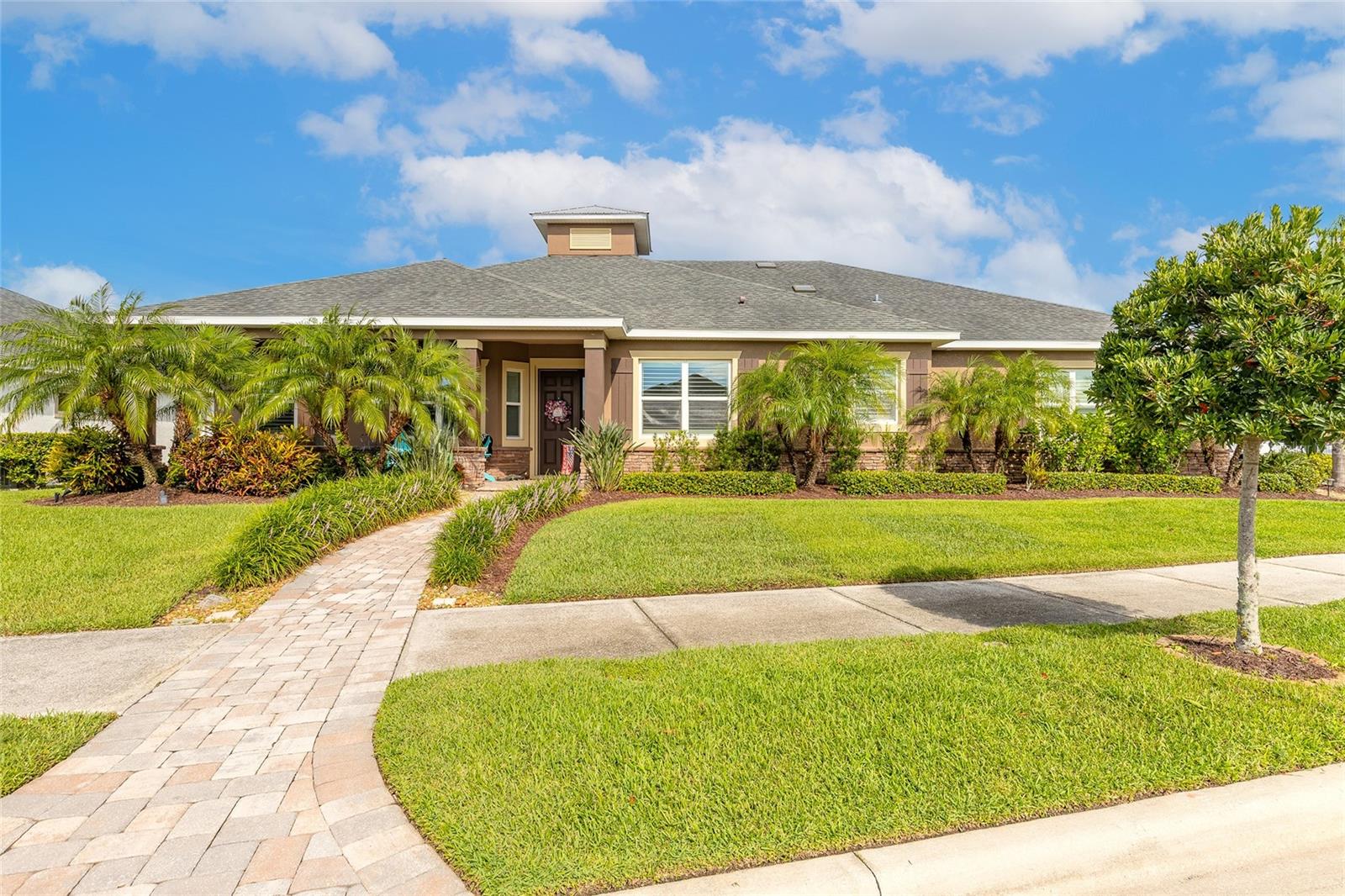 This stunning 4-bedroom, 2-bathroom custom-built home is located in the highly sought-after gated community of Venetian Bay. Boasting an oversized 4-car garage, the home features a screened saltwater pool, a fully equipped outdoor kitchen under a spacious lanai, and an additional paved outdoor living area—perfect for entertaining. Situated on a quiet cul-de-sac, the property overlooks the 18th green of the golf course and is just a short walk from the beautiful clubhouse. Inside, you'll find a thoughtfully designed layout with a massive kitchen island, upgraded cabinetry, designer lighting, and soft-close features throughout, including the oversized laundry room. The primary suite includes a walk-in closet with premium California Closets shelving and drawers, while the pantry is similarly upgraded for optimal organization. All bedrooms include walk-in closets, and plantation shutters add a touch of elegance throughout the home. The garage is a dream workspace, complete with a custom-built workbench, cabinetry, and ample storage.