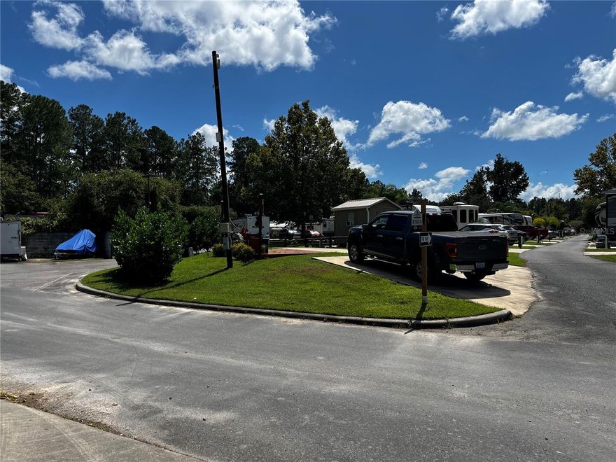 Beautiful, high-and-dry corner lot with a lush privacy hedge and full hook-ups in the highly sought-after Wilderness RV Resort—a premier waterfront community on the breathtaking Ocklawaha River! Tucked within the peaceful Ocala National Forest and along the famous Florida Ebony Bear Scenic Byway, this resort blends natural beauty with outstanding amenities. Enjoy direct access to the river for unforgettable paddling—kayak or canoe downstream from the world-famous Silver Springs to the park, surrounded by crystal-clear waters and abundant Florida wildlife. Spend your days exploring nearby natural gems like Salt Springs, Juniper Springs, and Alexander Springs, or relax at sparkling lakes including Lake George and Lake Kerr. Love outdoor adventure? The legendary Santos Trailhead offers over 30 miles of world-class mountain biking trails for all skill levels, plus countless hiking and nature paths. At the resort, you’ll find a sparkling pool, hot tub, fitness facilities, clubhouse, laundry, bathhouses, and more—all designed for comfort and community. When you’re ready for a change of pace, explore The Square in historic downtown Ocala, where live entertainment, a comedy club, a theatre, billiards, candy shops, boutiques, and exceptional dining await. Whether you’re seeking peaceful relaxation, thrilling outdoor recreation, or vibrant nightlife, this property puts you in the heart of it all and offers the perfect launchpad for your Florida lifestyle!