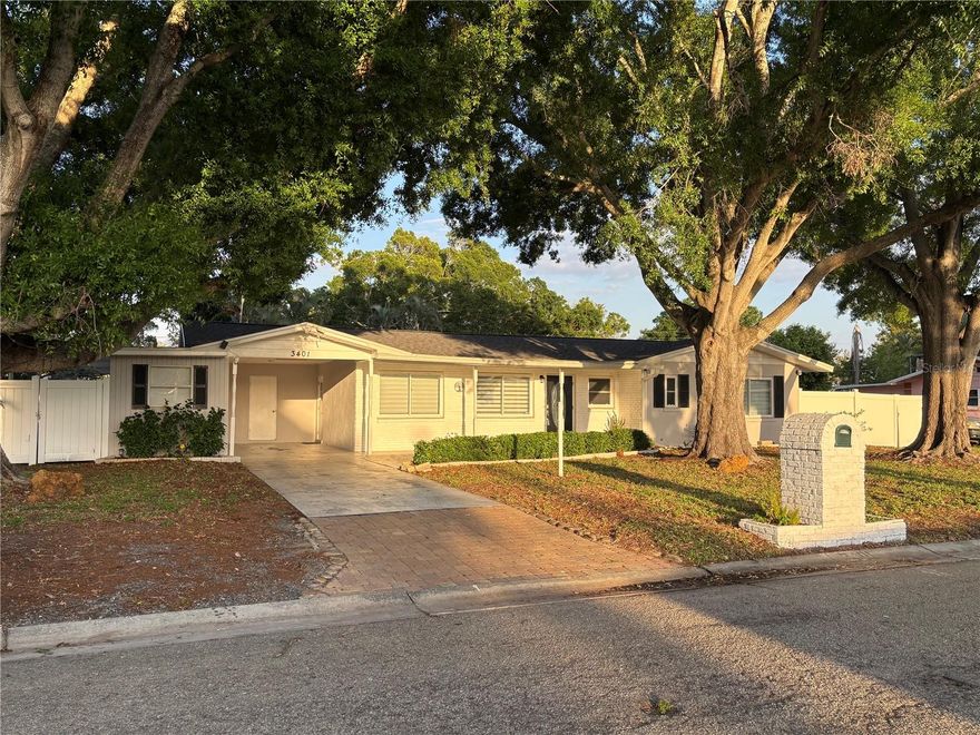 **A TRUE STUNNER!!!** This shaded 1/3 acre lot features a low maintenance property with impeccable details, abundant space and a QUIET STREET WITH NO THRU TRAFFIC. Renovated in 2023 with a NEW ROOF, the home includes a NEW KITCHEN with SS appliances, Calcutta quartz countertops and a marble backsplash, NEW BATHROOMS, NEW FLOORS, new light fixtures, window trim, crown moldings, baseboards, and new paint throughout! Too many upgrade details to list! The INCREDIBLE designer back yard includes a NEW SPA with a waterfall feature, and NEW VINYL FENCE throughout. The back yard has a separate area for storage of boats, RV's or other big toys. The property also features a carport, an outdoor laundry room with a new water heater(2025) and a bonus room off the carport with its own new AC presently used as an office. Nestled in the heart of West Bradenton, residents enjoy the freedom of no deed restrictions and the flexibility of short-term rentals. As an added bonus, the property is currently an AirBnB, located in Unincorporated Manatee County which permits greater flexibility as it does not have specific county-wide ordinances governing short-term rentals as compared to limits  in neighboring areas. Minutes away you will find the pristine Gulf beaches (Bradenton Beach and Anna Maria Island), SRQ Airport, IMG and great dining and shopping. With no HOA, this home is ideal for full-time residents, seasonal getaway, or smart investment. Furnishings are negotiable. Schedule your private tour today!