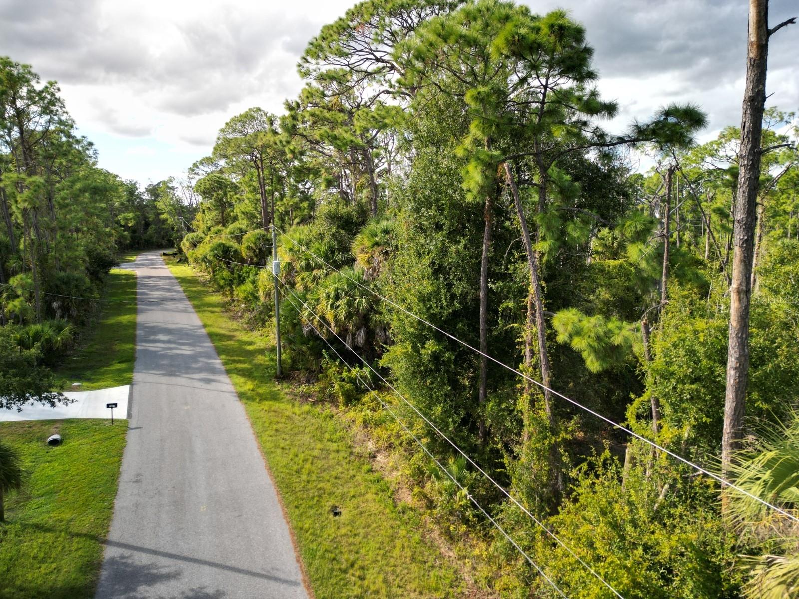 PRICED TO SELL! Discover the perfect opportunity to build your dream home or expand your investment portfolio with this ¼-ACRE RESIDENTIAL LOT on Greenley Road in North Port, Florida. Ideally located in a quiet, growing neighborhood surrounded by new construction, this property offers excellent potential for builders, investors, or nearby property owners looking to add value to their existing holdings.
With no HOA or deed restrictions, you’ll have the freedom to design the home you want — whether it’s a primary residence, vacation retreat, or rental investment. Power is nearby, and the lot sits in a desirable area close to shopping, dining, schools, golf courses, and I-75, providing easy access to all that Southwest Florida provides.